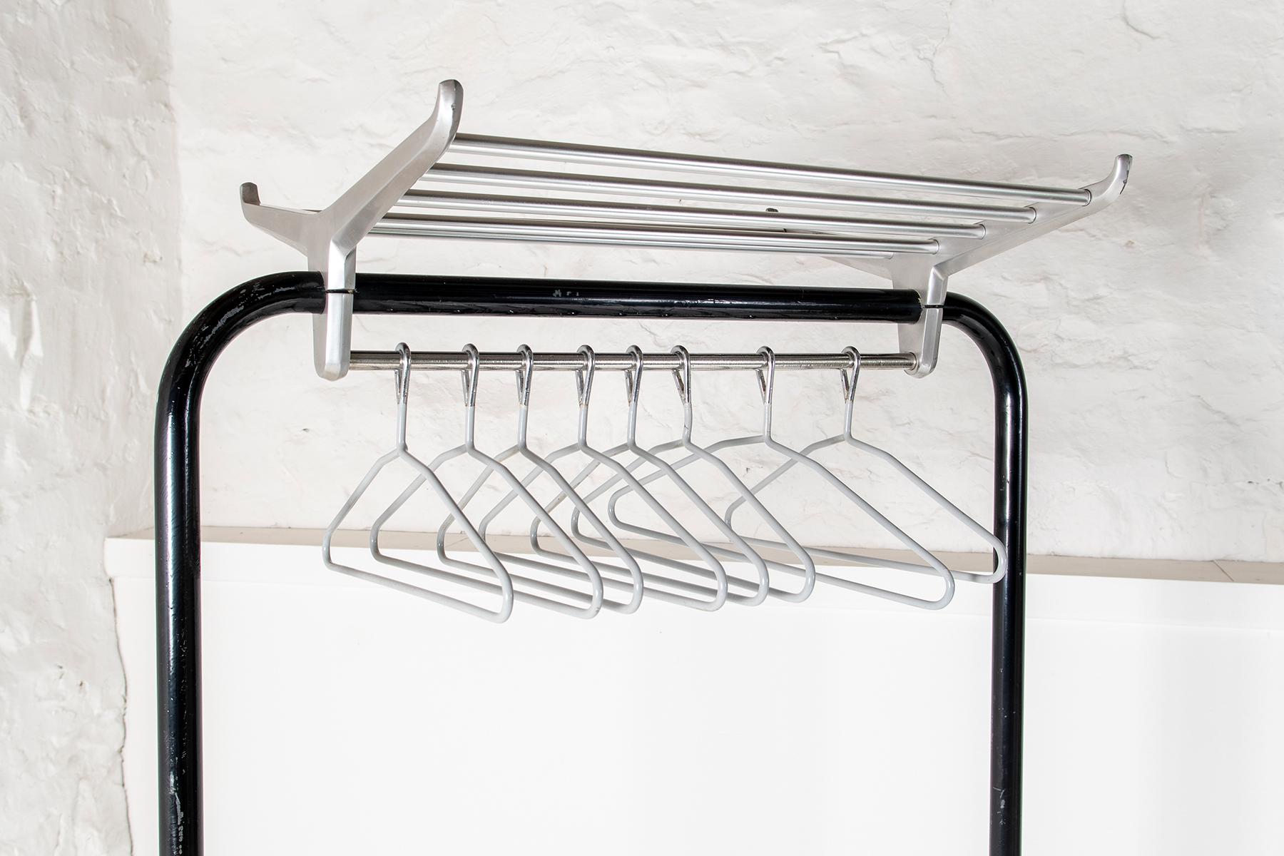 An original example in excellent order, black enamel coated frame with polished aluminium luggage rack. This example is a nice handy size and will fit most Cloakrooms or Hallways.
Retains all its original parts, including the umbrella holders each