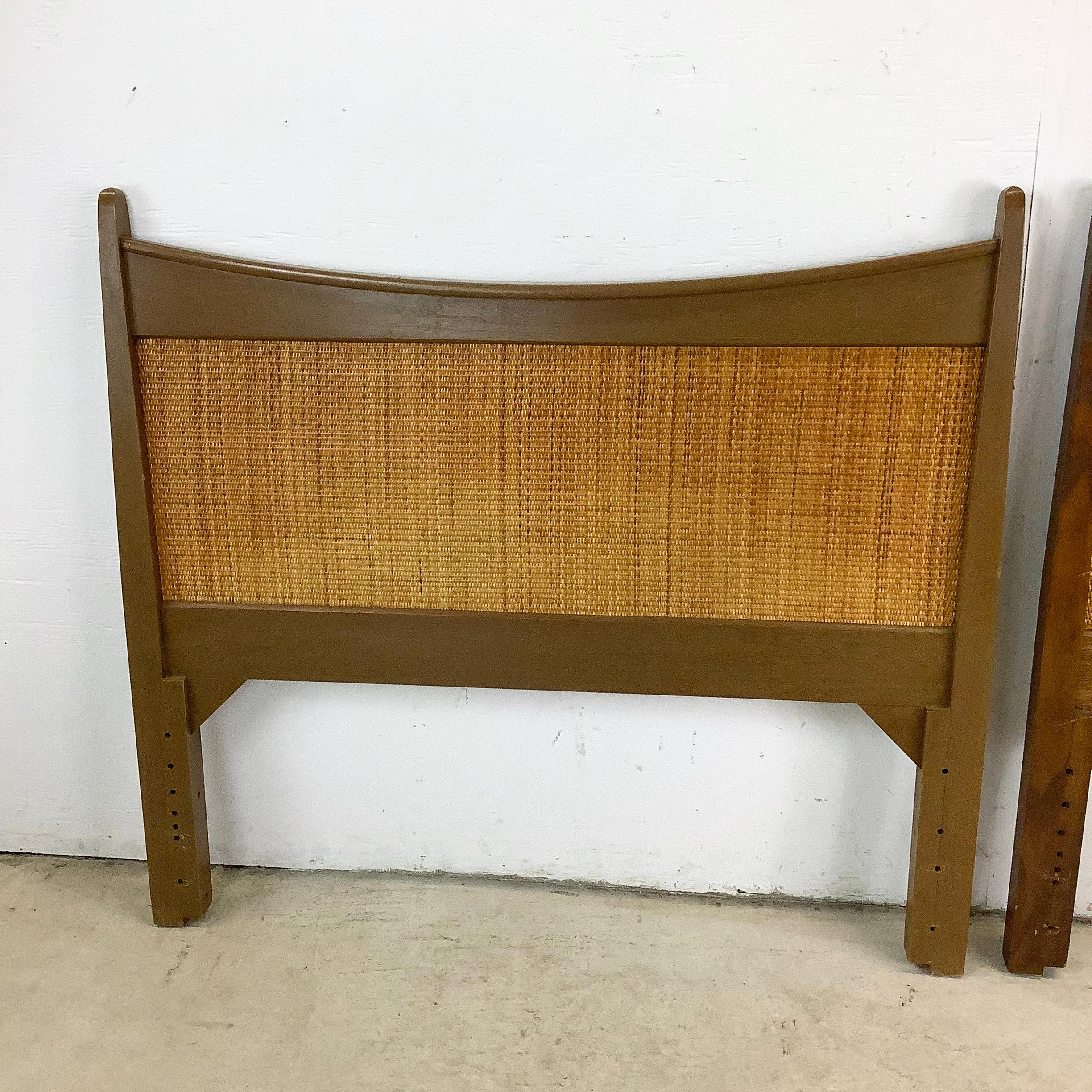 Introduce timeless mid-century style into your home with this pair of Danish modern twin headboards, crafted from rich walnut and woven cane. Their clean lines and warm wood tones evoke classic Scandinavian craftsmanship, while the airy cane