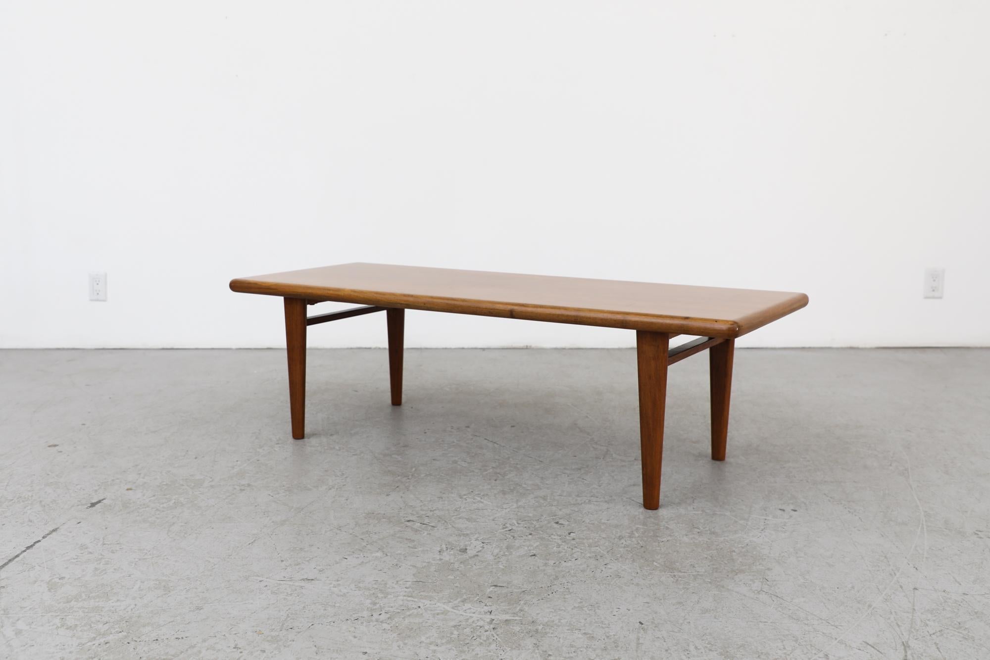 Mid-Century Heavy Danish Teak Coffee Table with Tapered Legs & Thick Rounded Top In Good Condition For Sale In Los Angeles, CA