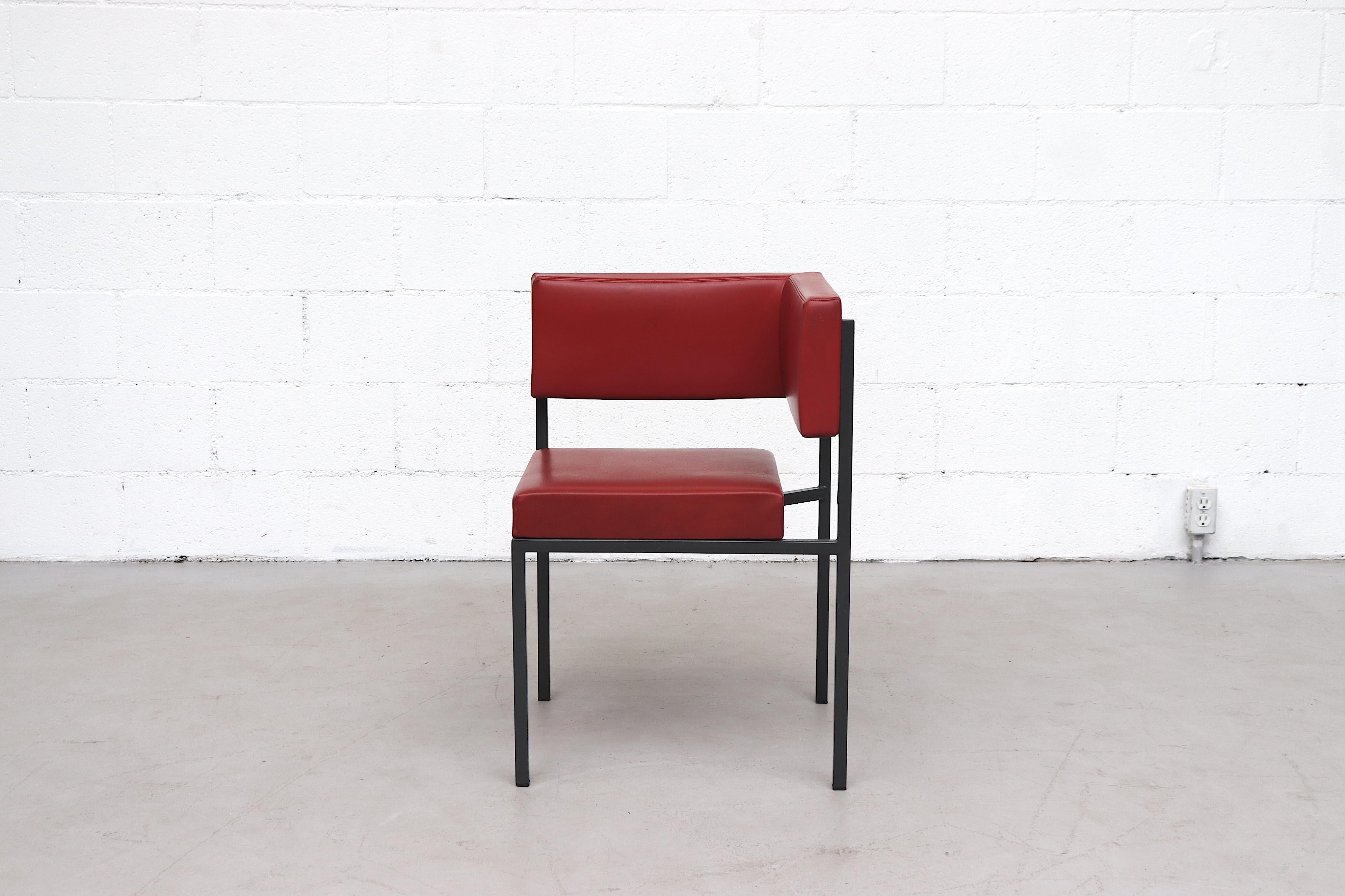 Awesome midcentury red skai corner chair. Original red skai upholstery on a square almost black enameled metal frame. In original condition with some wear and visible blemish to skai and light wear to frame.