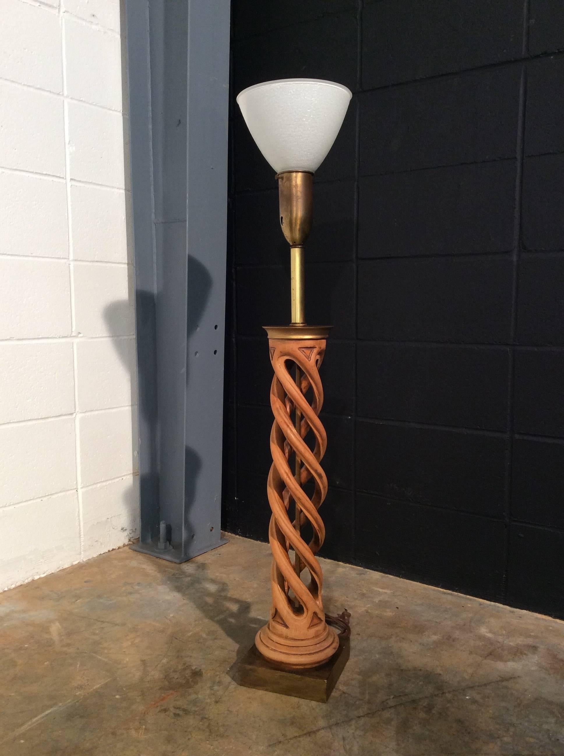 Carved midcentury helix lamp by Frederick Cooper. Amazing carved wood lamp creating a twist and resting on a gold leaf base. Lamp has new wiring.
No known defects that would detract from value or aesthetics.
Ready for use.
