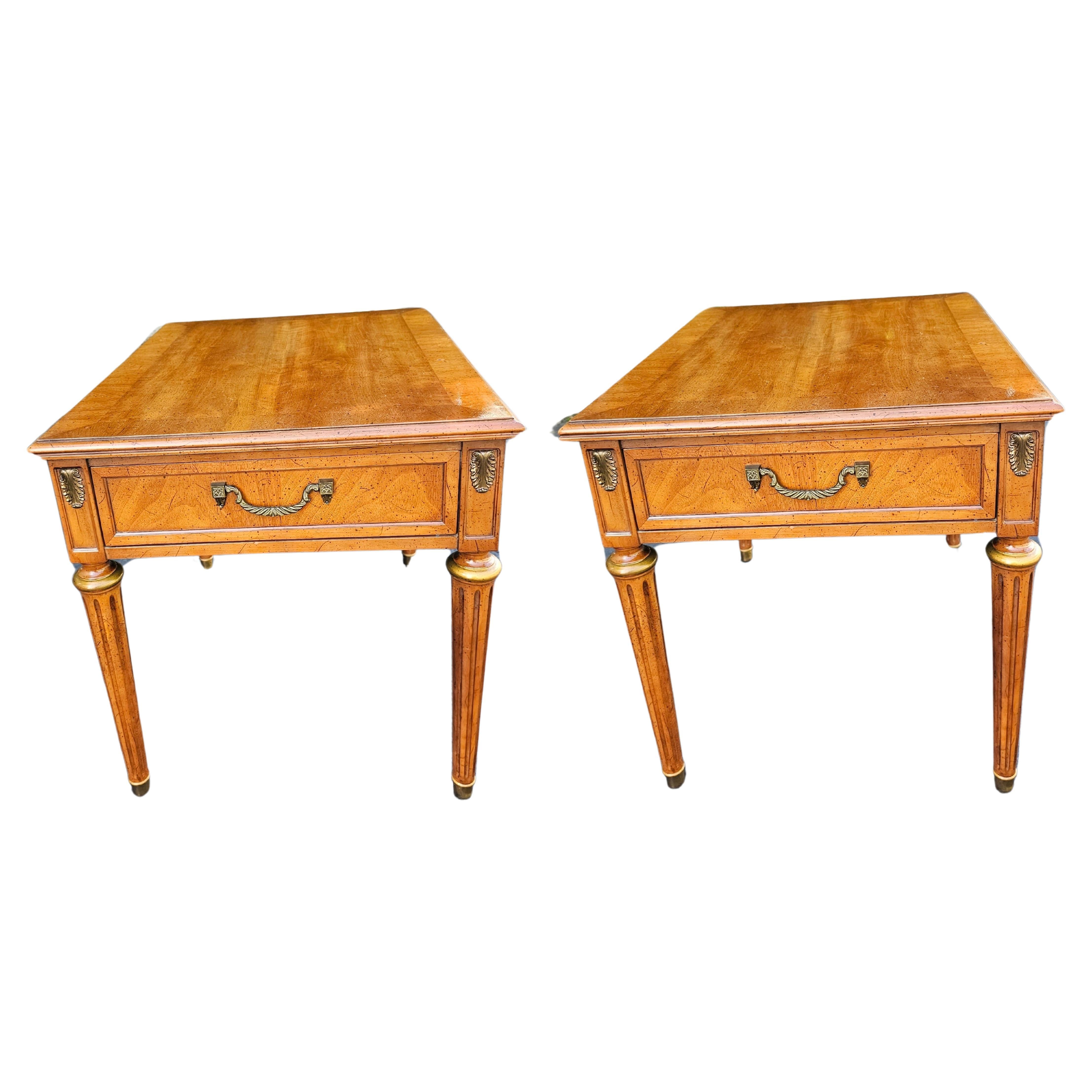 A  pair  of Mid-Century Henredon Fine Furniture Parcel Gilt Fruitwood & Brass Mount single drawer Tables.
measure 