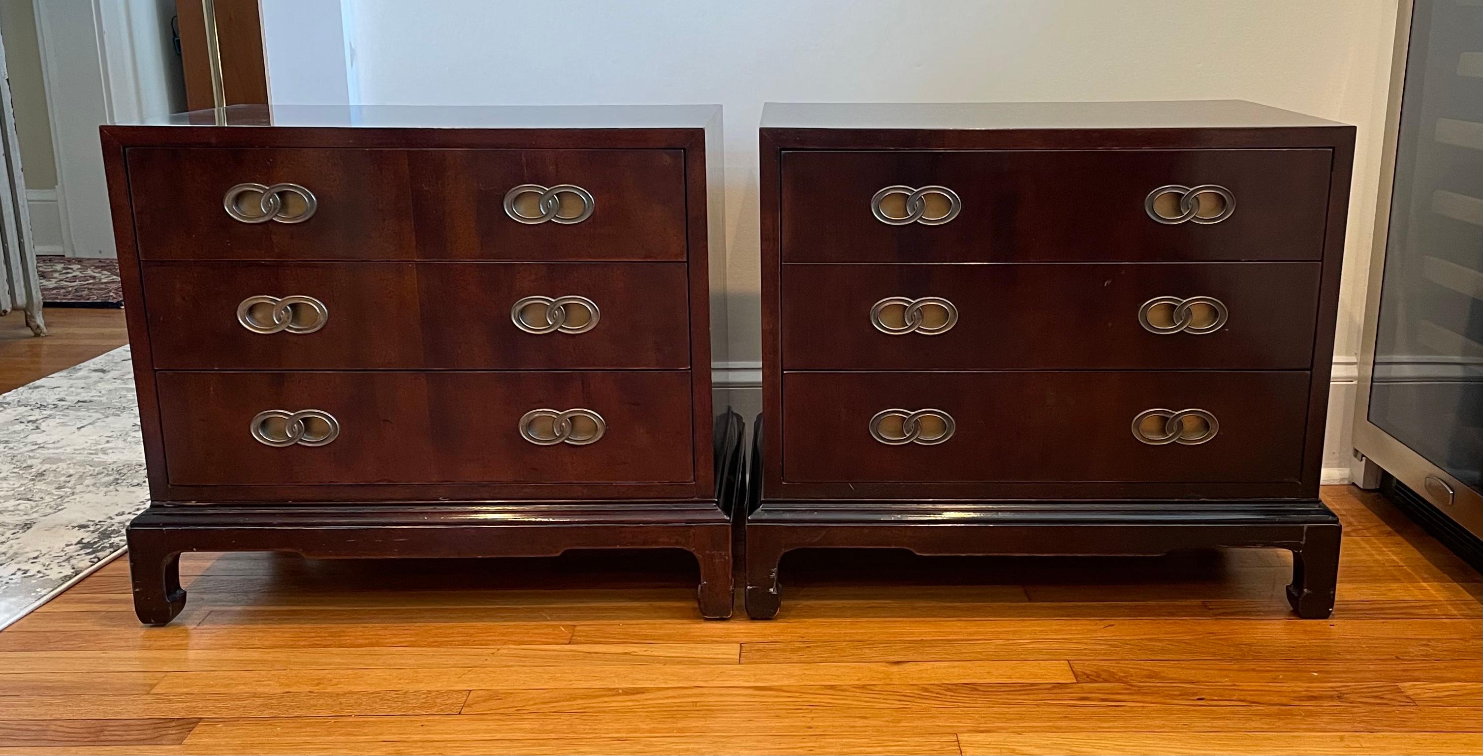 Ebonised bracket Ming style base 3 drawers mid-century nightstands by Henredon. Classic Michael Taylor double ring pulls. Custom glass tops for surface protection.