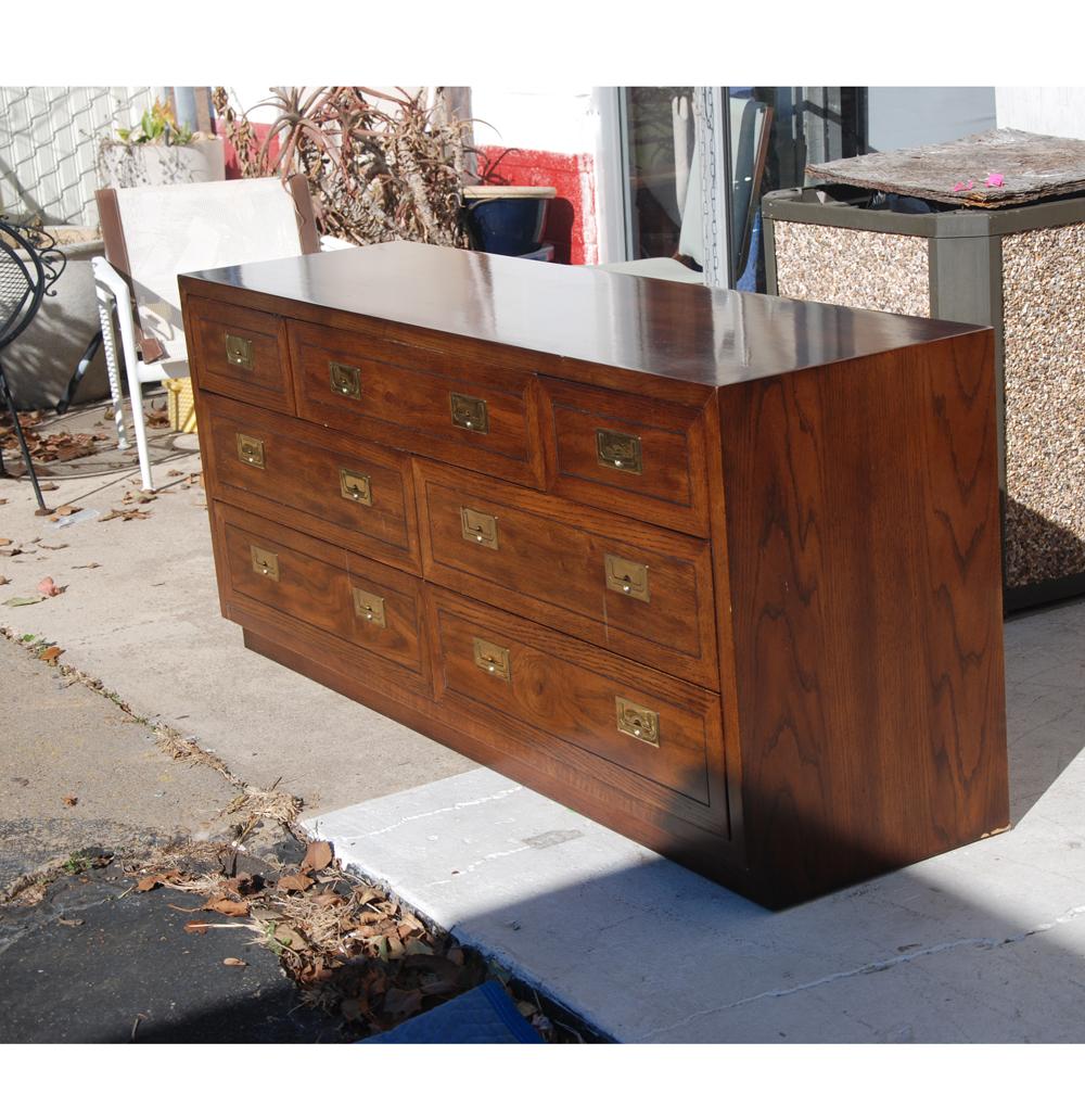 Mid Century Henredon Fine Furniture Scene One 1
Campaign Dresser Credenza

 
 Campaign dresser constructed of walnut with brass accents.
Seven drawers. 

see matching tall dresser