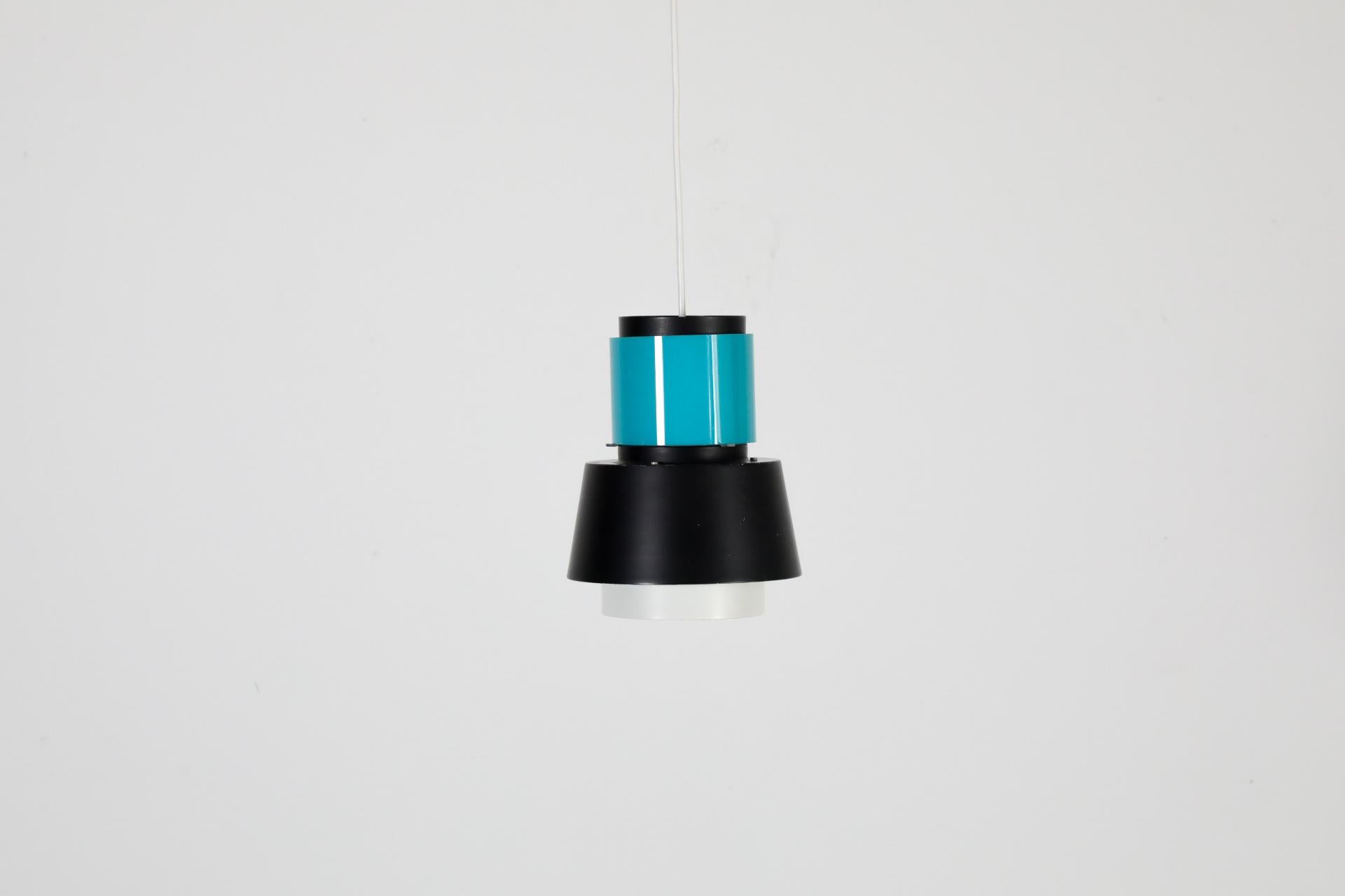 Rare Dutch Mid-Century pendant with turquoise glass ring by famed lighting manufacturer Hiemstra Evolux. In business as Hiemstra Evolux from 1960 to 1975 after having been established in 1934 by Niek Hiemstra and his brother-in-law as Hiemstra &