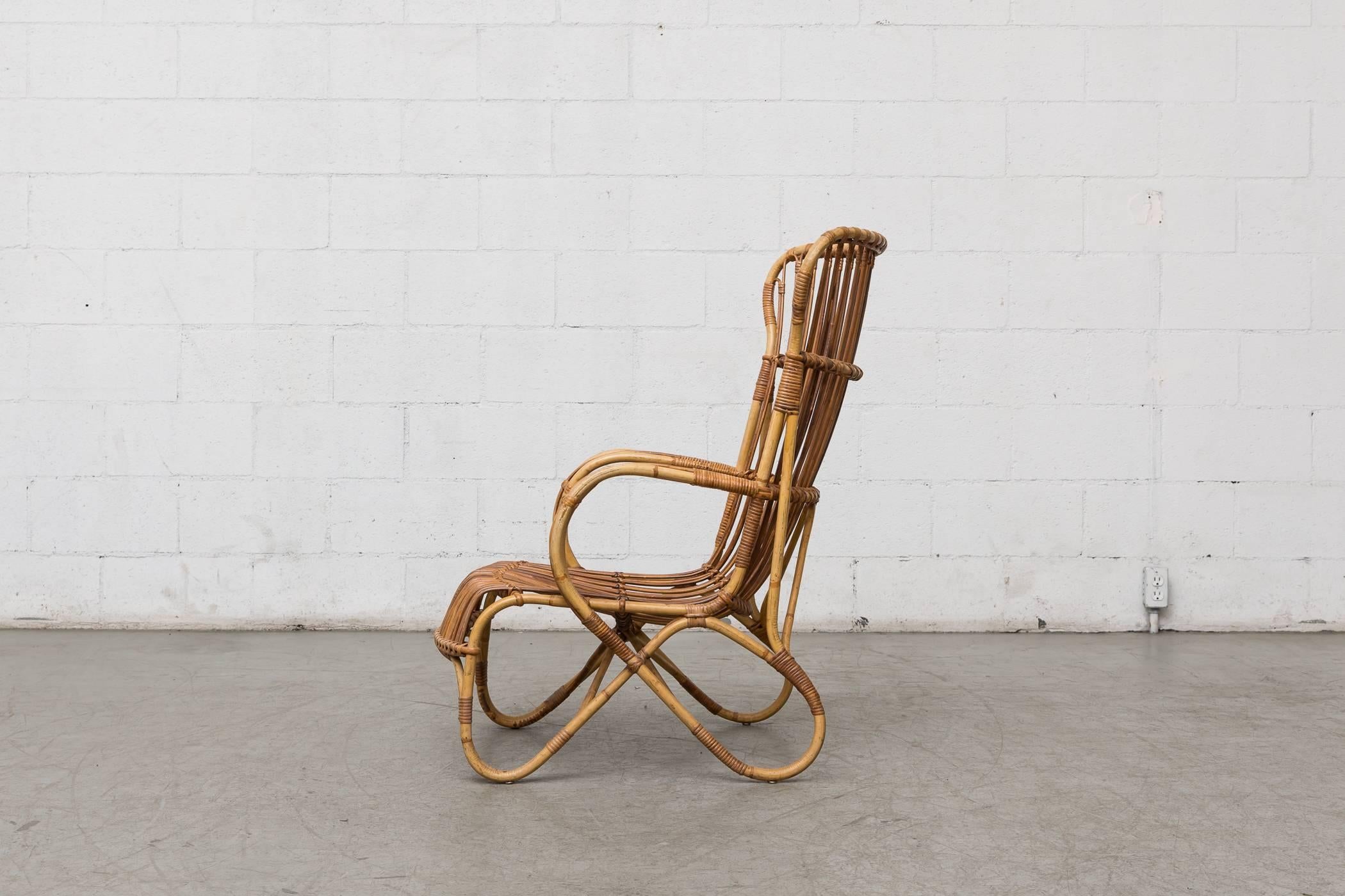 Midcentury high back bamboo lounge chairs with nice golden color with minimal bamboo loss and breakage. Wear consistent with its age and usage. Small repair (pictured).