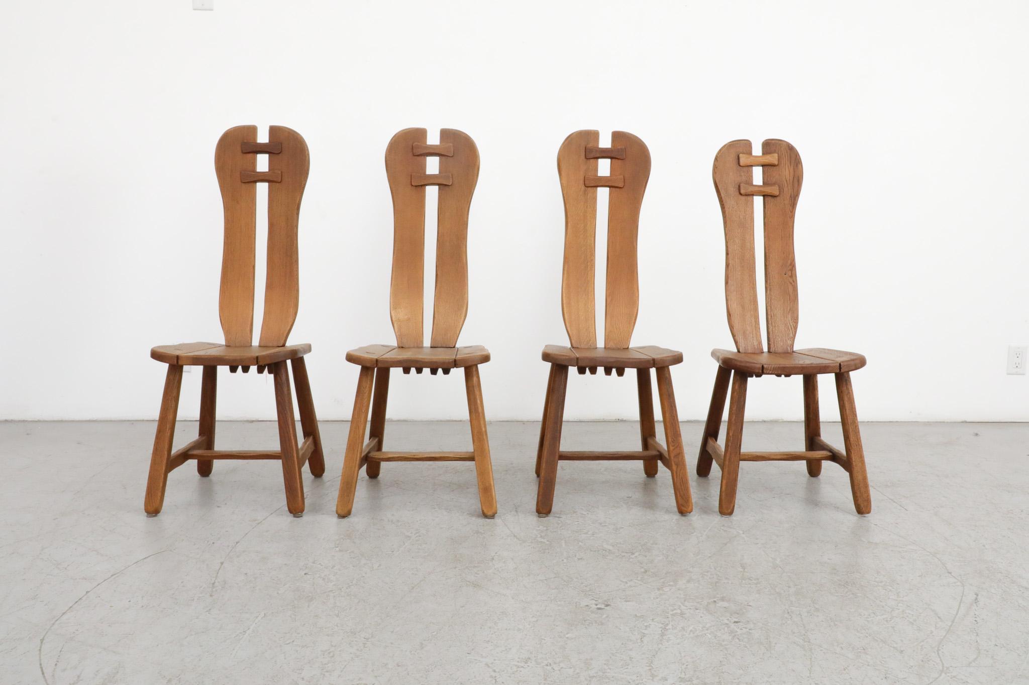 Set of 4, Mid-Century, high-back brutalist dining chairs manufactured by De Puydt, Belgium, 1970's. Sturdy oak with heavy grain, normal wear and lovely, deep patina for their age. In original condition with some visible cracking. Another matching