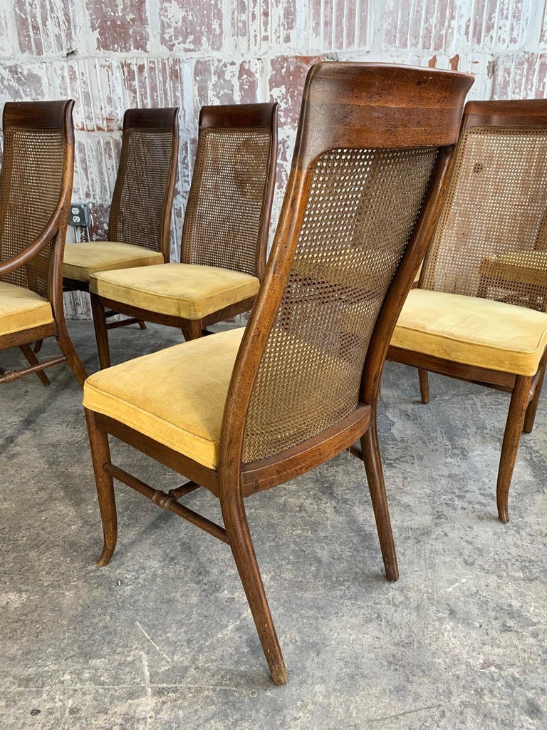 Vintage Cane Back Dining Chairs / A natural wood finish on the solid wood frame and legs 