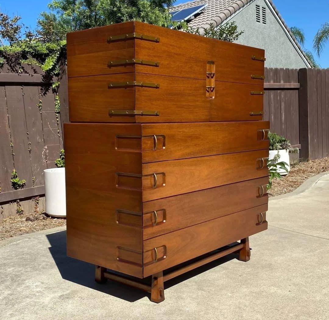 Next on the list is another piece designed by Edmond J. Spence for Industria Mueblera S.A. of Mexico c1950s. This exemplary highboy features bronze hardware with recessed details and footwork that highlights intersecting joints. Craziest part is