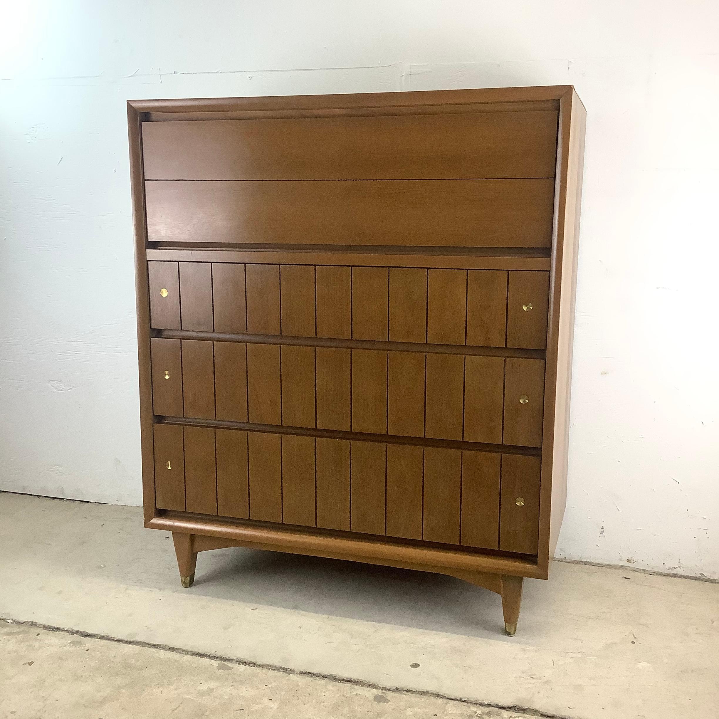 Elevate Your Space with this Mid-Century Modern Highboy Dresser by Kroehler furniture.

Introducing this Kroehler Mid-Century Highboy, a stunning piece from the 1960s that captures the essence of mid-century design. With its sleek walnut finish and