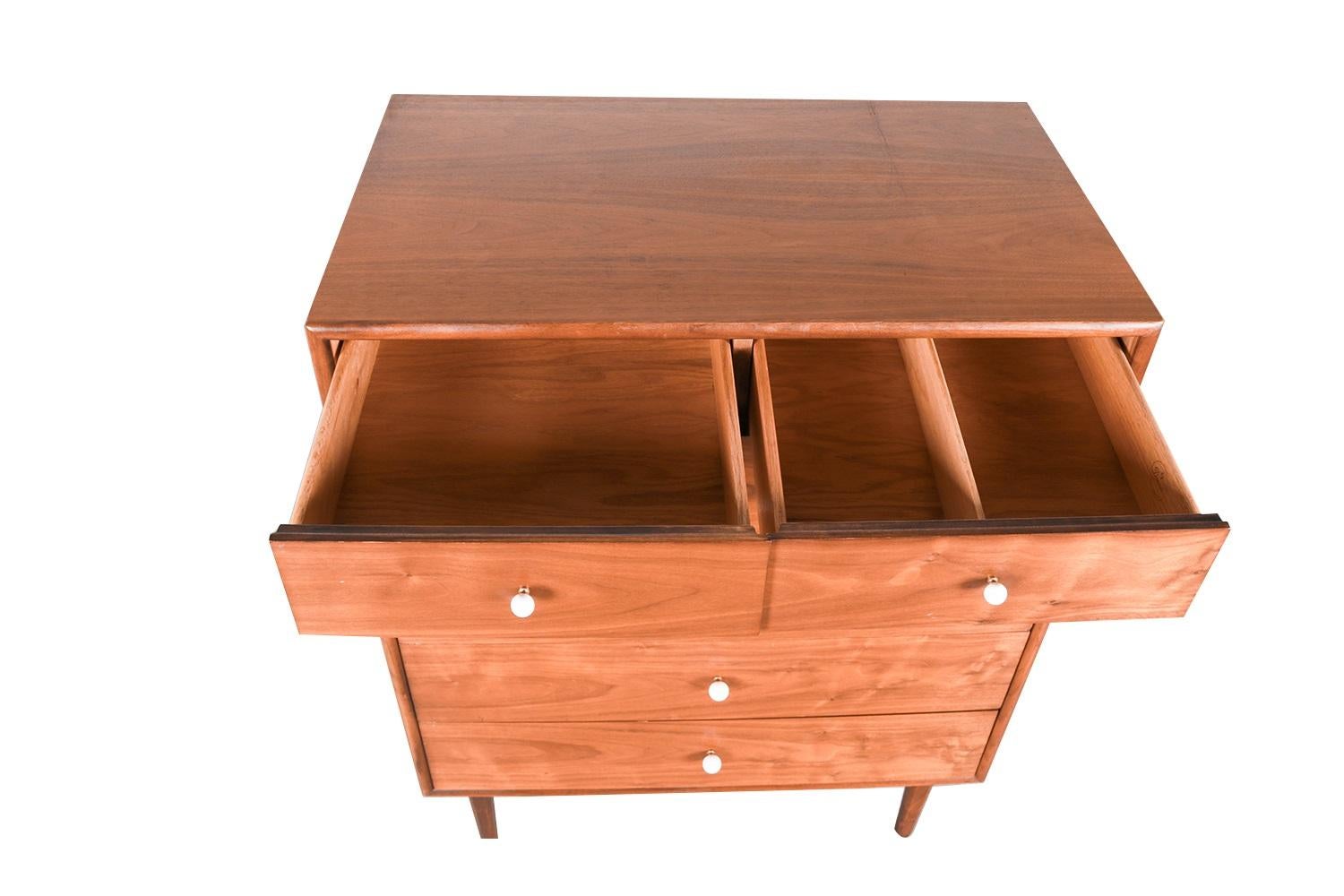 Beautiful Mid-Century Modern tall dresser/highboy/chest of drawers designed by Kipp Stewart and Stewart MacDougall for Drexel’s Declaration Collection, circa 1960s. Featuring a solid, beautifully grained walnut wood case and frame, housing six