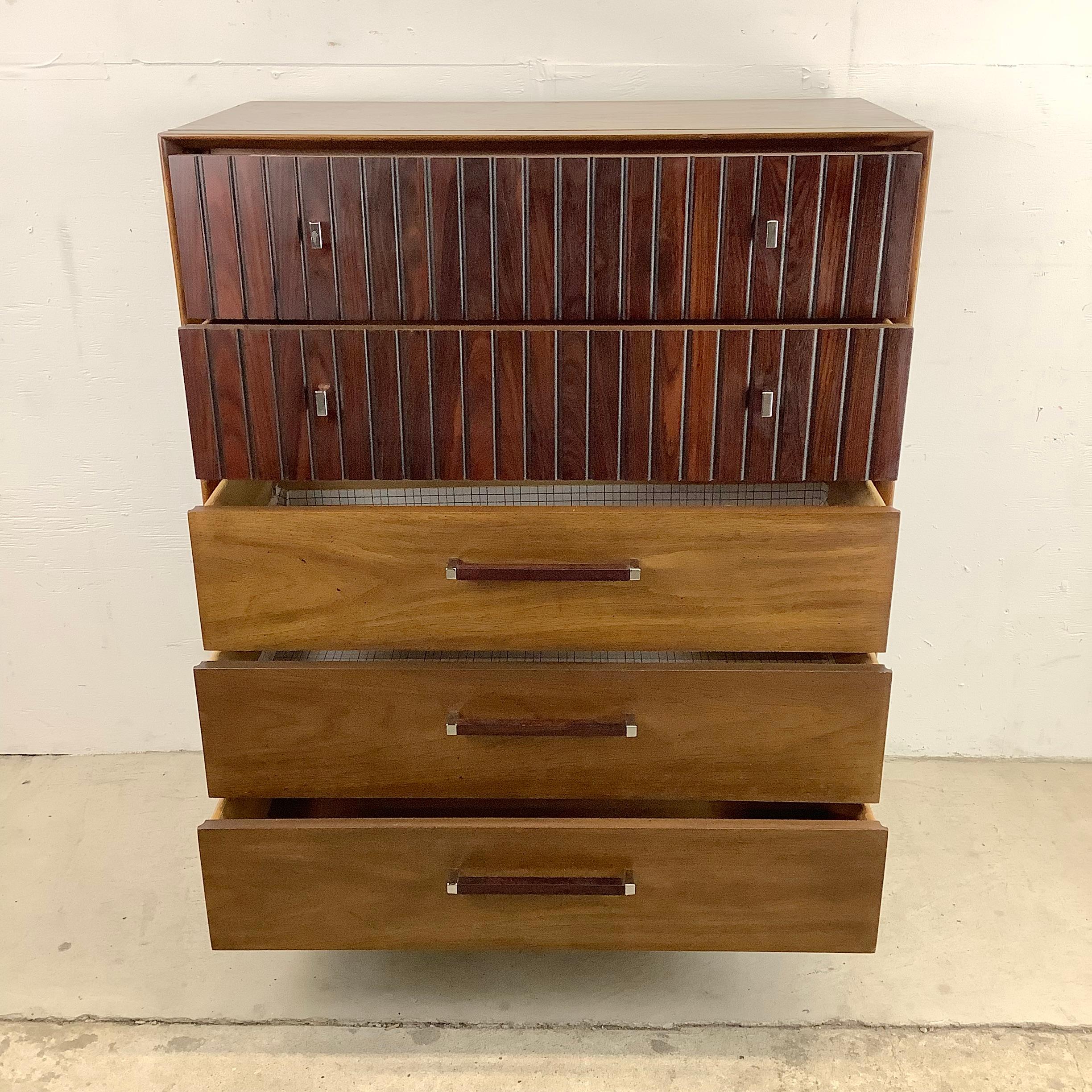 This impressive mid-century modern highboy dresser from Lane furniture features two tone hardwood finish with unique drawer pulls and stylish plinth base- perfect mix of woods and chrome finish add to the clean modern lines of this vintage highboy