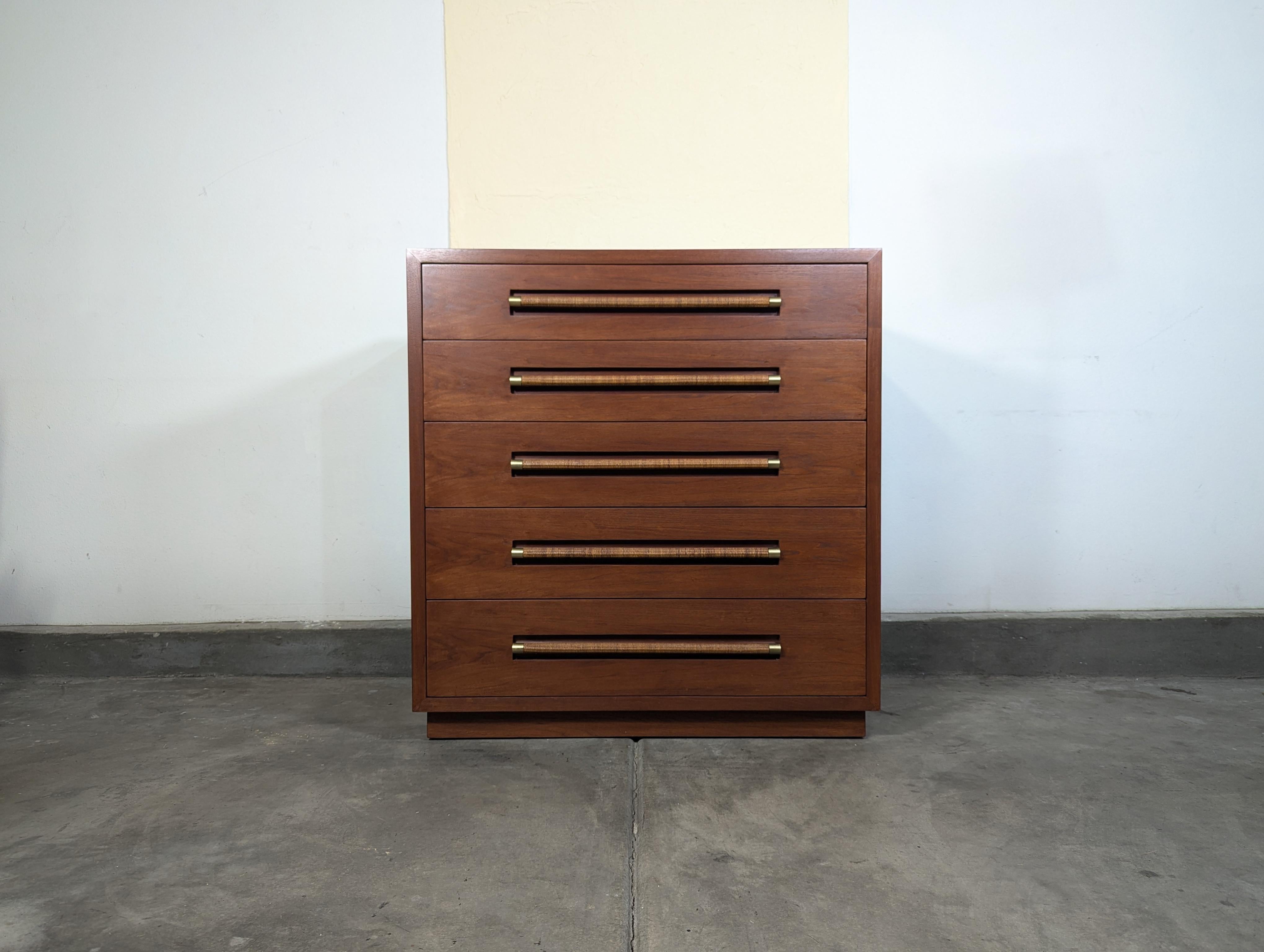 For sale is a stunning Vintage Mid Century Highboy Dresser by Morganton, dating back to the 1960s. This exquisite piece has been lovingly refinished, showcasing a rich mahogany frame that exudes timeless elegance. Measuring approximately 42″ wide,