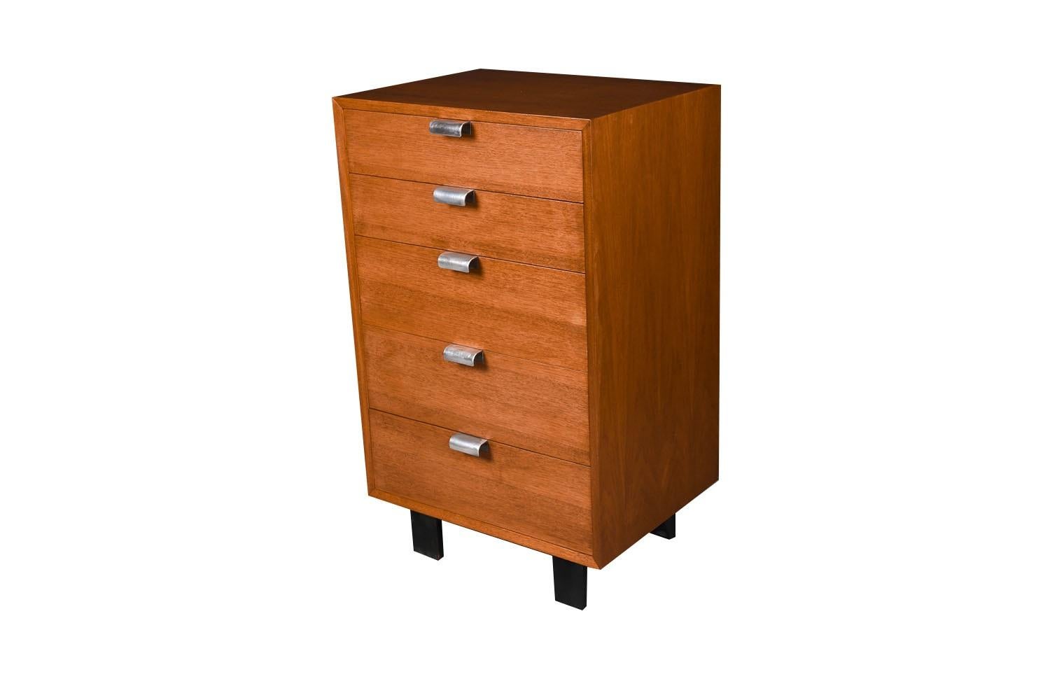 Iconic and classic Mid-Century Modern tall five drawer dresser designed by George Nelson for the Herman Miller Primavera line, circa 1950s. Iconic piece resulting from the collaboration of these two MCM Masters! Often referred to as the Primavera