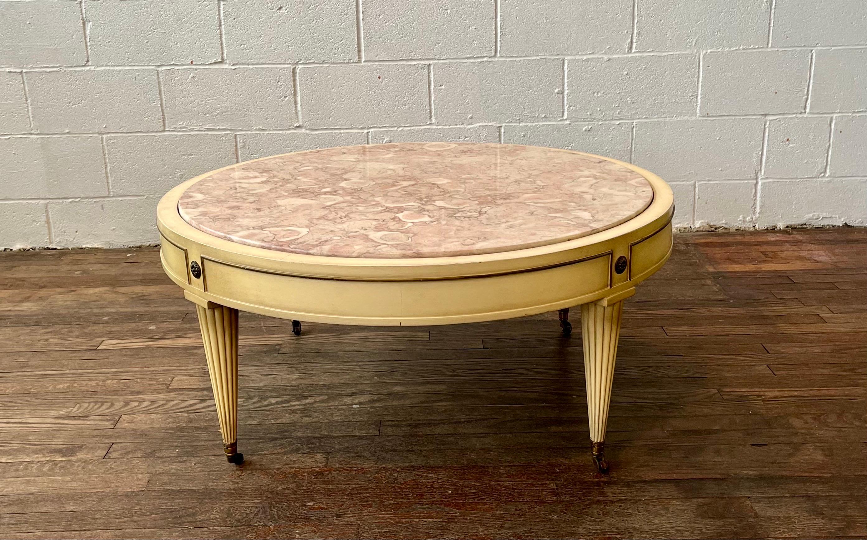Classic pink marble coffee table set in regency style frame. Great lines and presence with pink fossilized marble top. Ornamental legs capped with brass casters. R&J Arnold Corp.
Curbside to NYC/Philly $300