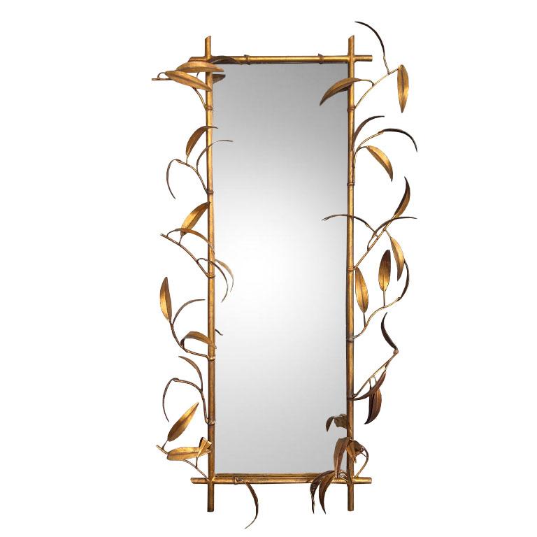 Elevate your space with this exquisite Mid-Century gilt bamboo mirror from the 1960s. This statement mirror showcases fabulous craftsmanship, blending Chinoiserie elegance with timeless Hollywood Regency glamour.

The gilded metal faux-bamboo frame