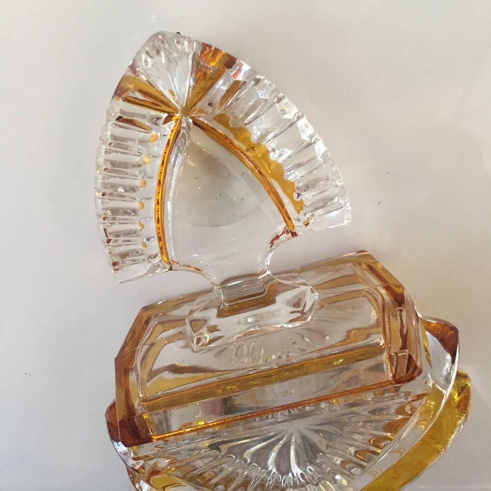 Two-tone Hollywood Regency glass vanity box with original stopper featuring a decorative ribbon pattern.
 
circa 1950.
 