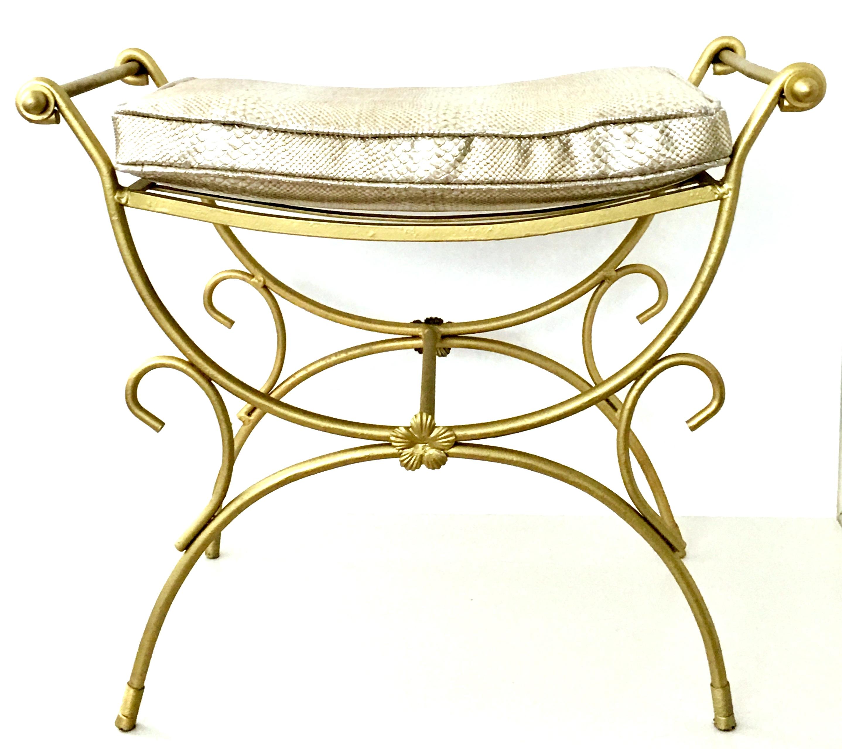 Mid-20th Century Hollywood Regency gold iron and faux python cushion bench. This gold metallic painted wrought iron bench features flat iron support straps across the seat. A newly fabricated 2