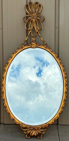 Mid-Century Hollywood Regency Italian Carved Giltwood Ribbon Mirror