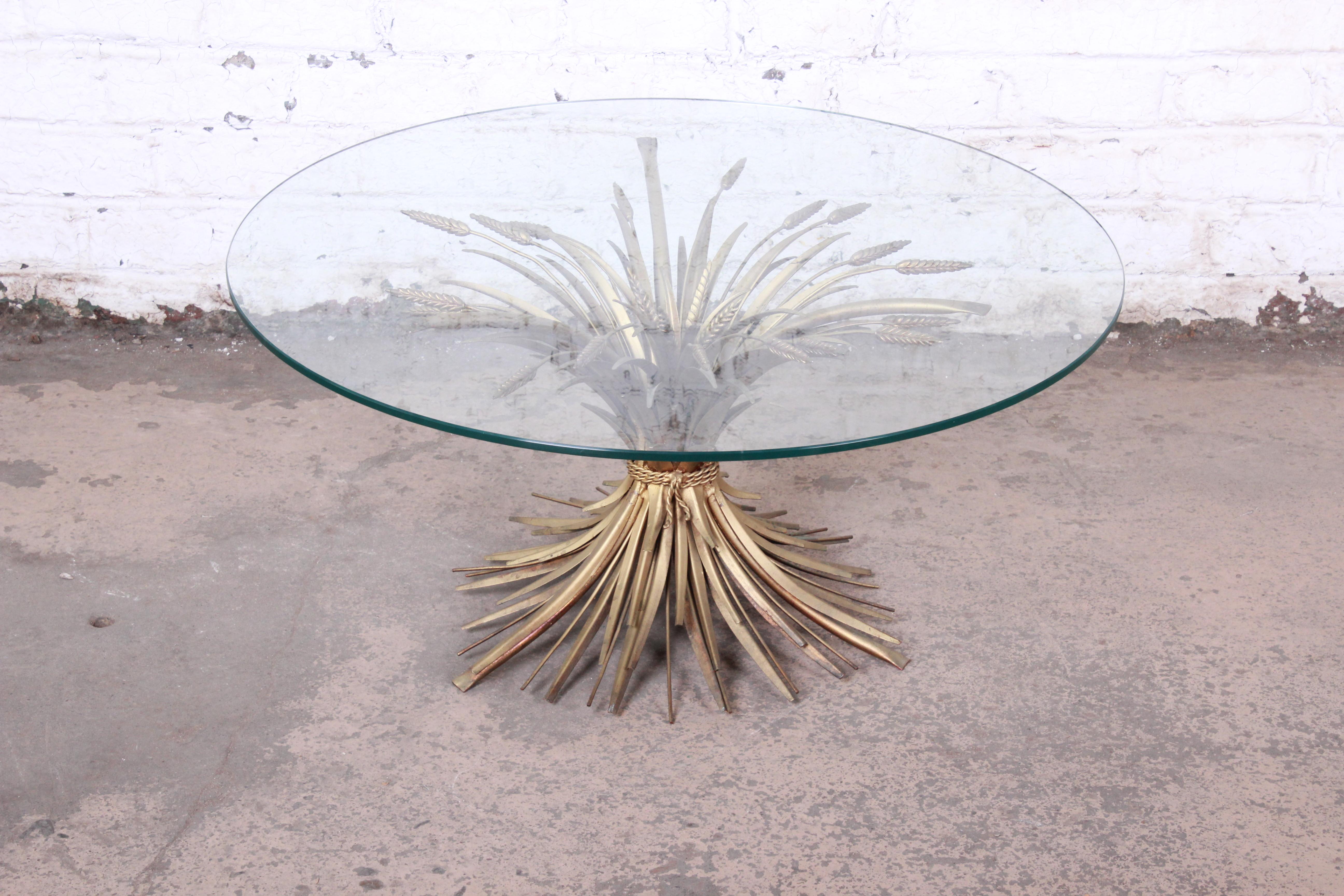 A gorgeous Mid-Century Modern Hollywood Regency sheaf of wheat coffee or cocktail table

Italy, 1960s

Gold gilt steel and glass

Measures: 36