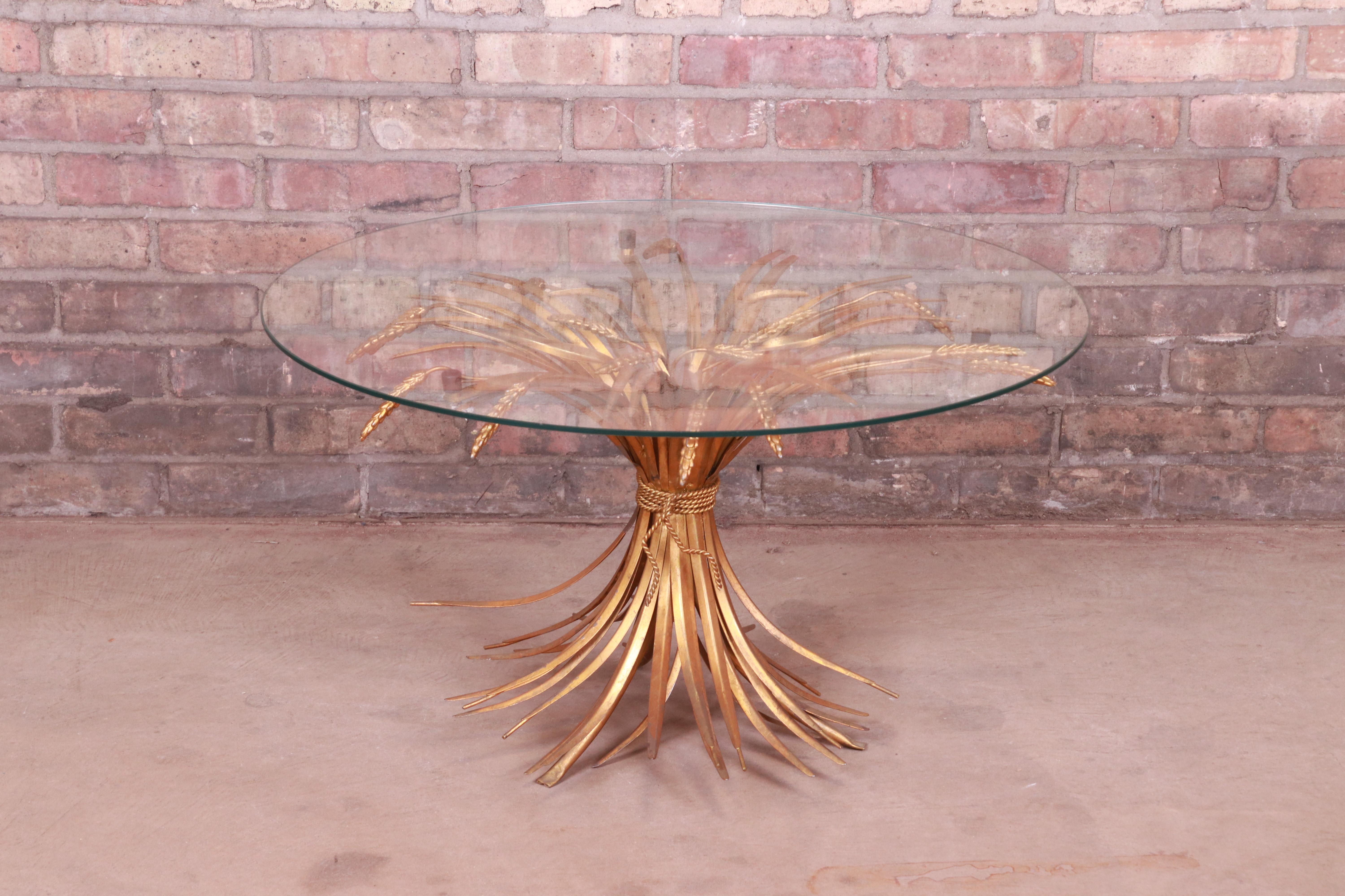 A gorgeous Mid-Century Modern Hollywood Regency sheaf of wheat coffee or cocktail table

Italy, 1960s

Gold gilt steel, with glass top.

Measures: 30