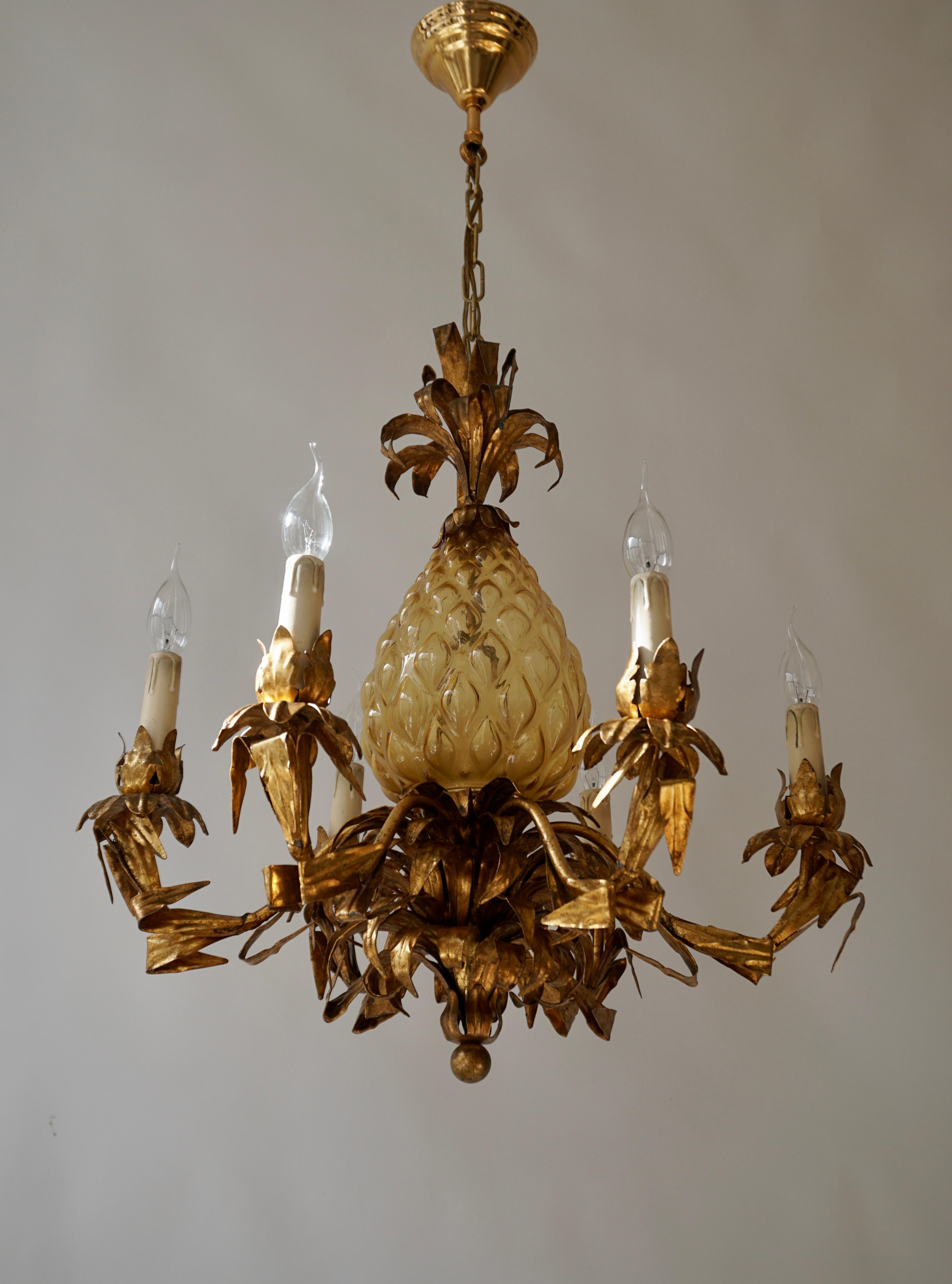 Rare circa 1970s brass and Murano glass multi arm chandelier with pineapple motif. Made in Italy. 

A beautiful timeless high quality chandelier that will enhance any setting.Good luminating light spread, in very good condition.Please note of wear