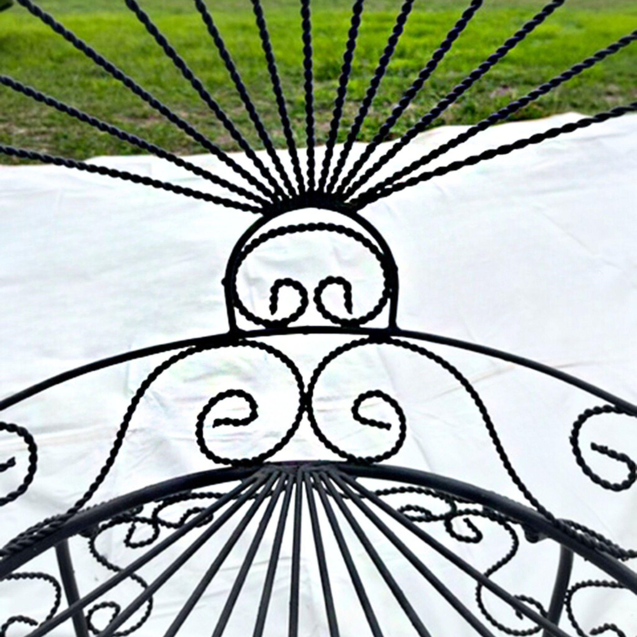 Gorgeous mid-century John Salterini attributed wrought iron fan back peacock chairs, a pair. These pieces have been repainted to black in the last few years and have minor wear to the finish. Upholstery is in good recently new condition, made for