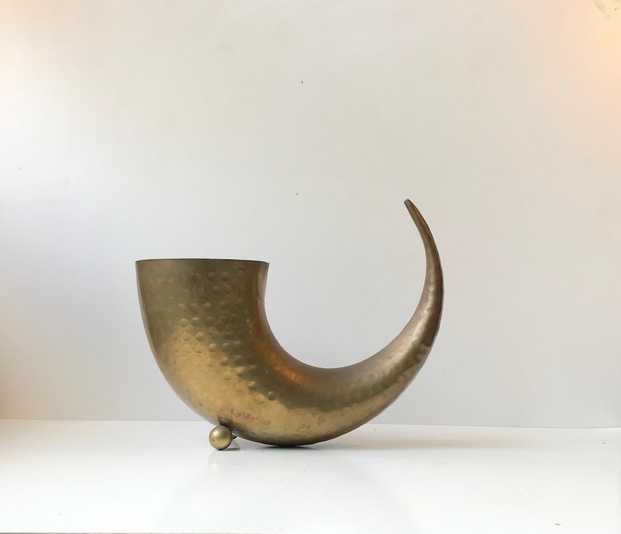 Unusual sculptural horn shaped flower vase made from solid partially hammered brass. This vase came out of a church in Thorstup located in the southern part Denmark. It was used for storing the most prominent Bouquet of flowers during Funerals,