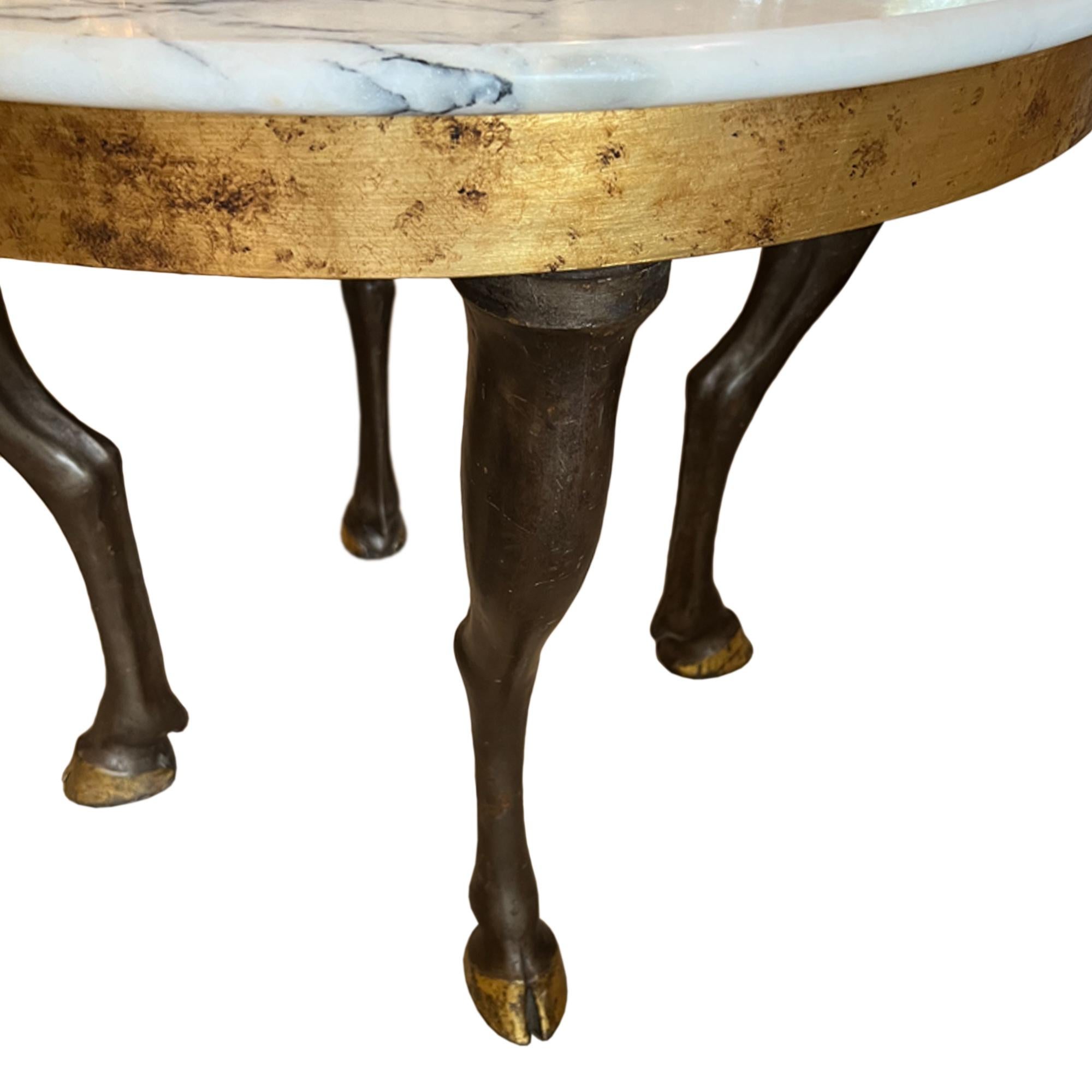 A fabulous table!

Made in France in the late 1960s - The beautful later marble top is supported by horse's legs, with gilded hooves. Please take a look at all our pictures to see the detail.

A great example of unique mid century design.