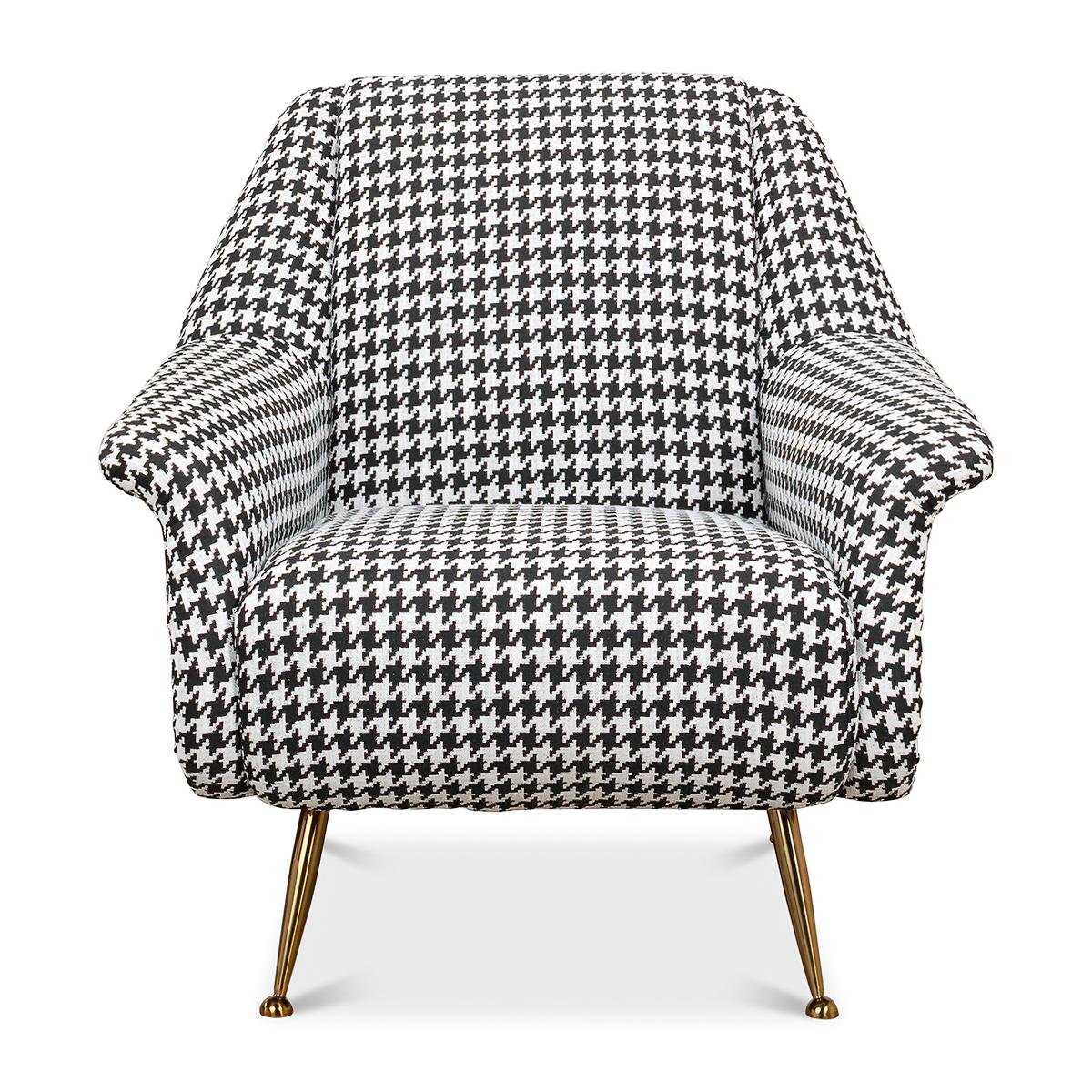 Mid century armchair with houndstooth on linen fabric, tightly upholstered cushion backrest, and seat, raised on gold-toned steel splayed legs.

Dimensions: 33