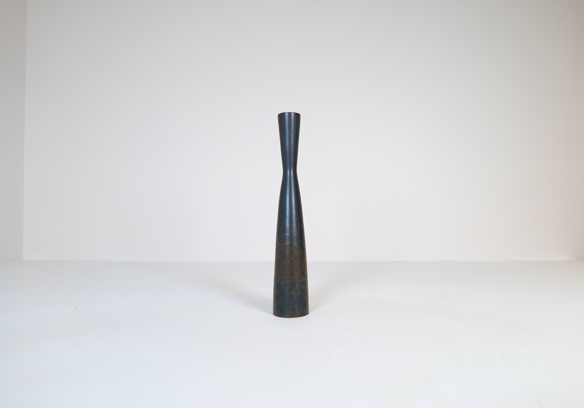 This exceptional vase from Rörstrand and maker or designer Carl Harry Stålhane, was made in Sweden in the midcentury. Its beautiful glazed combined with its incredible hourglass shaped forms makes this an exceptional good piece. The glaze and