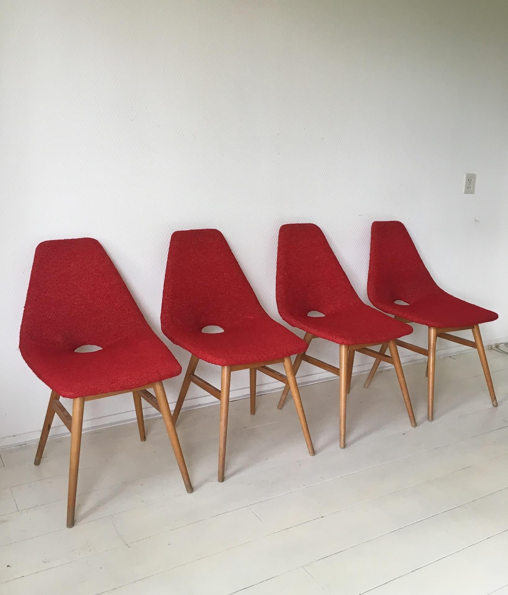 These stunning Hungarian chairs were designed by Judit Burian and Erika Szek in the 1950s. The chairs feature a beech base and flexible bentwood seating in original fabric. The chairs are in good condition but their base do show signs of age and use