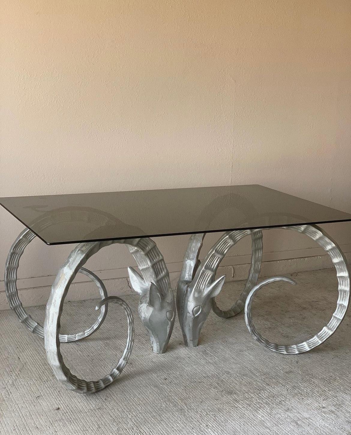 Iconic pair of Ibex Ram table bases after Alain Chervet.  Aluminum material with cast marks visible from some angles. A seductively raw look into the artist's process within the finished product.

Extremely heavy pieces that will support a glass,