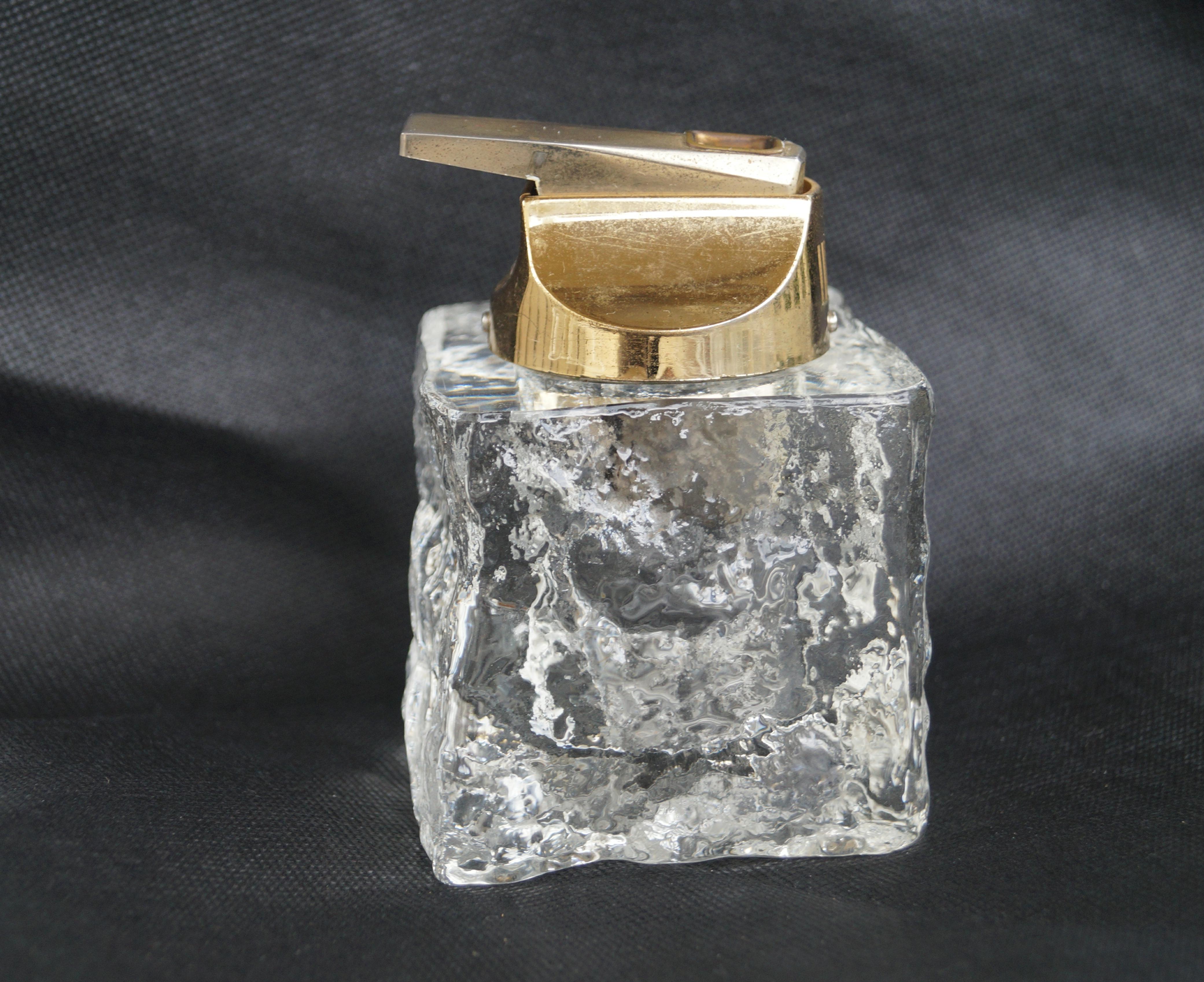 Mid Century Modern Glass Ice cube Table Lighter. In the style of Antonio Imperatore Murano glass .  Believe the glass may be from Italy. The metal is marked Japan, so may have been replaced at some point.