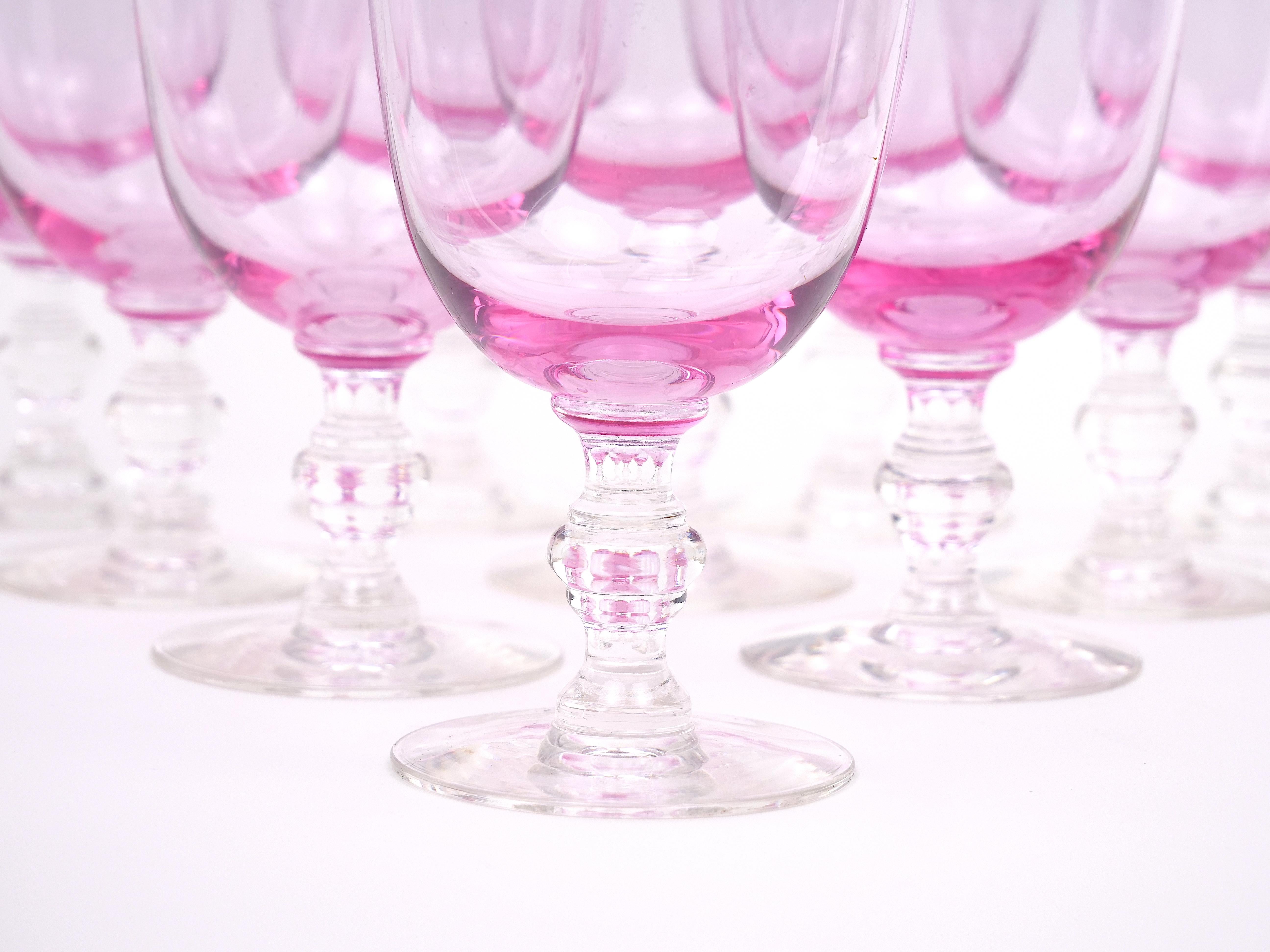 Step into a world of retro sophistication with our captivating mid century ice pink colored crystal barware goblet service for ten people. Imbued with the charm of yesteryear, this collection is sure to transport you to a bygone era of elegance and