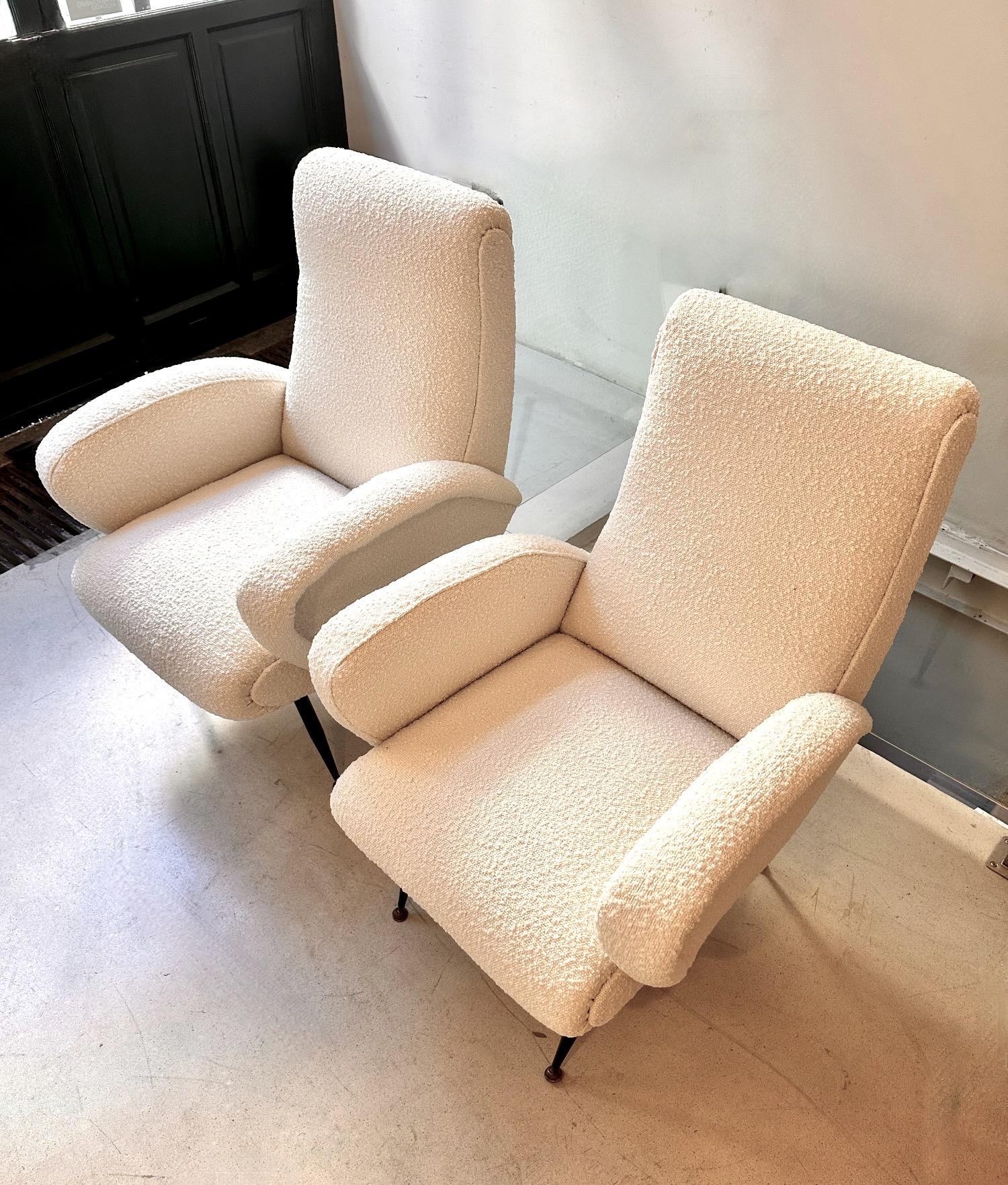 A pair of Ico Parisi Italian armchairs edited in the fifties.Reupholstered in Italian wool fabrics. Metal enameled and brass legs.Extremely confortable. .Free  profesional packing is provided..