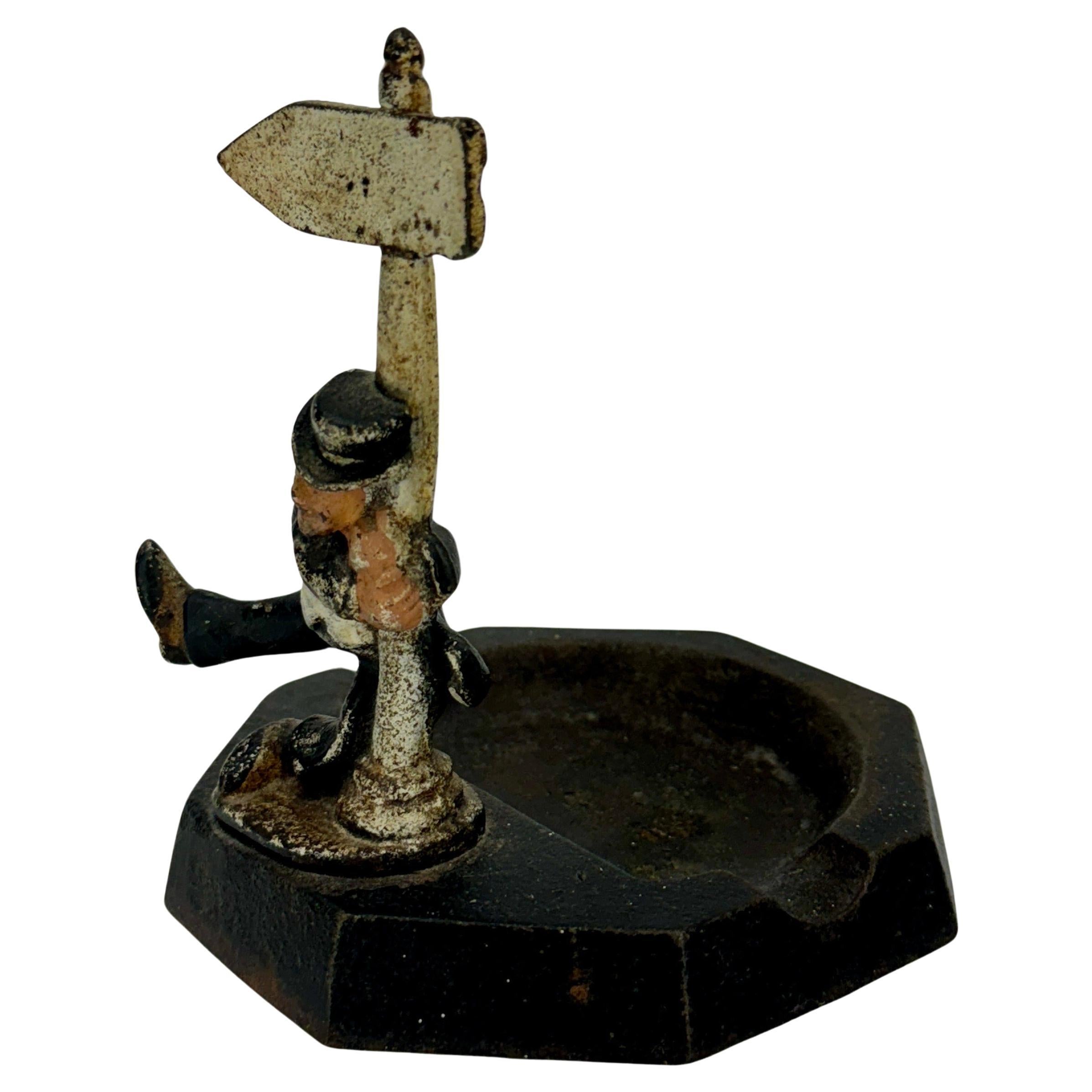 Mid-Century Iconic Cast Iron Ashtray with Drunken Gentleman with Flag For Sale