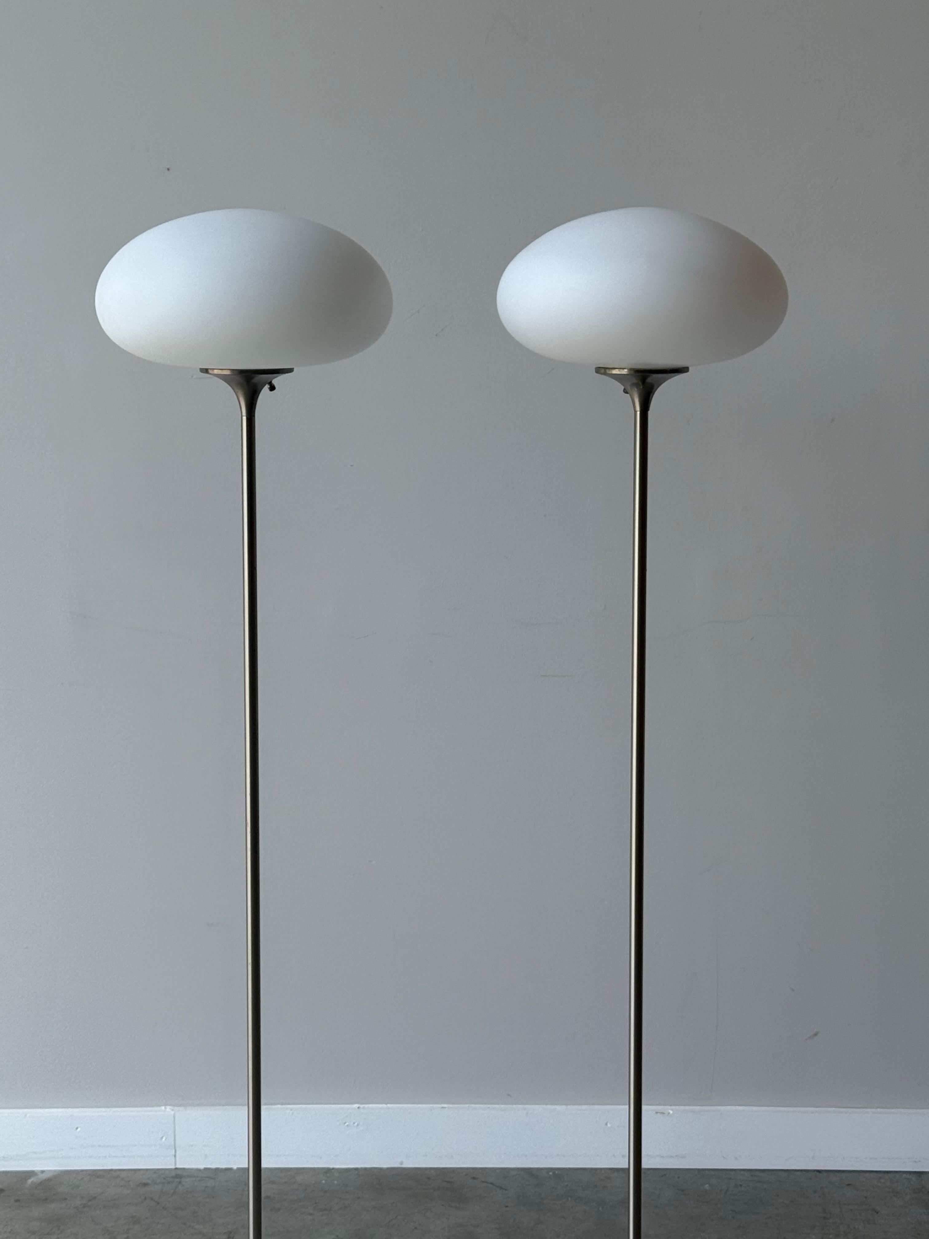 Mid-century mushroom floor lamp. Designed by Bill Curry for Laurel Lamp Company, circa 1960s. We have two available, price is per lamp. Purchase one as a single floor accent lamp or purchase both for a matching pair. 

The sleek stem and round base