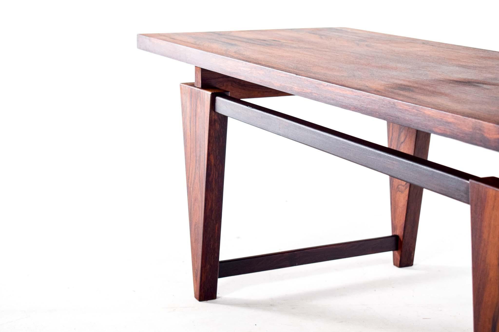 Danish rosewood coffee table by Illum Wikkelso, model ML115, designed in 1960 for Møbelfabrikken Toften. Beautiful rosewood veneer top, Features geometrical design with impression of the table top floating in the air. Very elegant and table with a