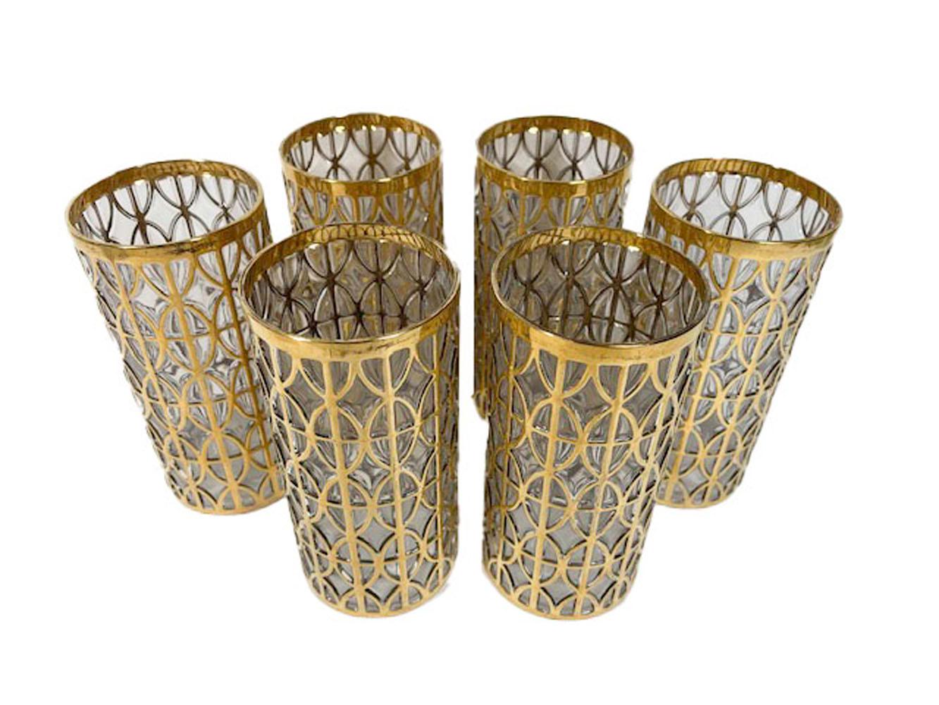Six Mid-Century Modern highball glasses in the 'Tabique de Oro' pattern by Imperial Glassware Company. This pattern has a blown-out pattern of overlapped ovals and squares forming geometric patterns of raised lines which are cobered in 22 karat
