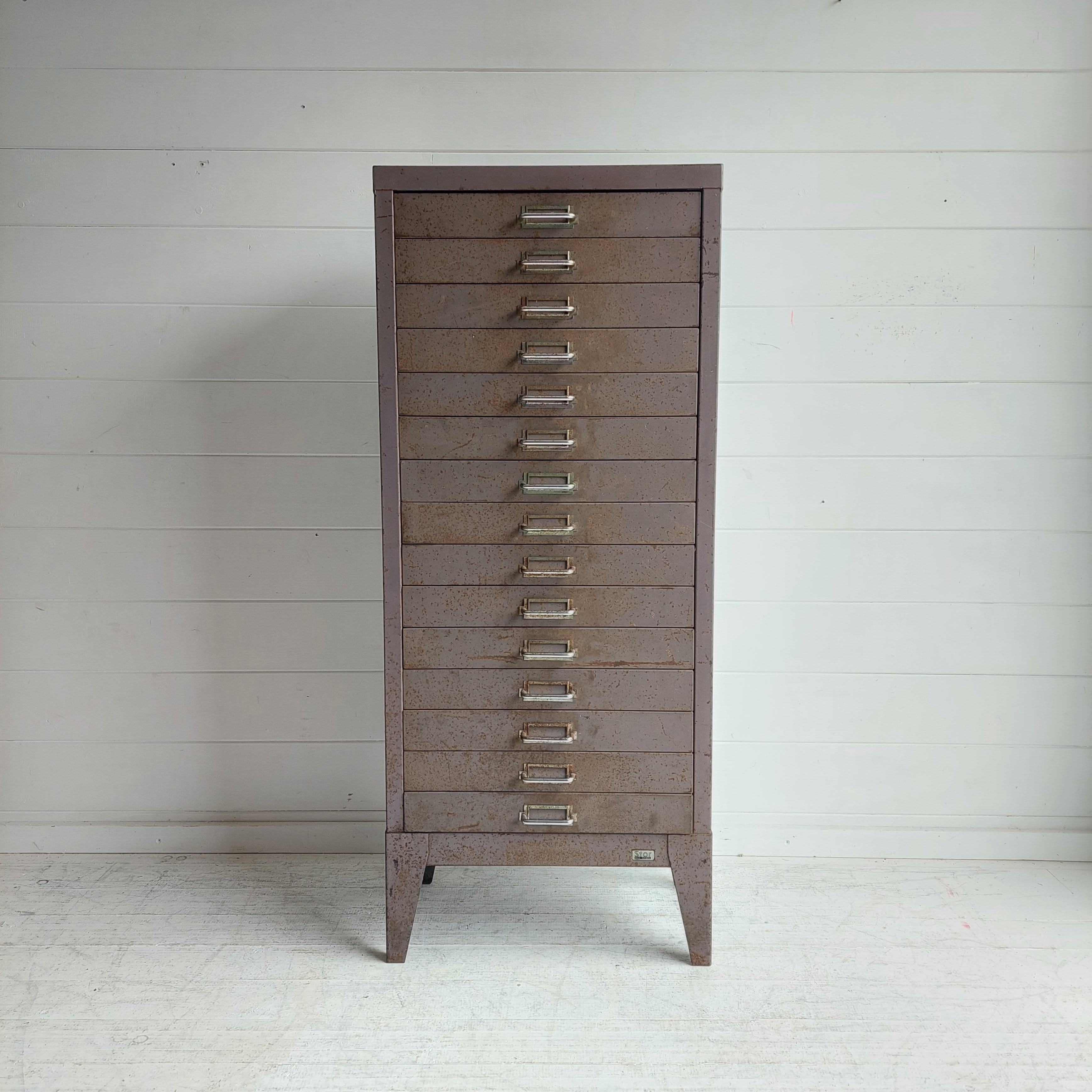 Tall and Narrow Reclaimed Vintage Industrial 1950s  Steel 15 Drawer Filing Cabinet with chrome handles. 
Manufactured by Stor
This is a very rare model with 15 shallow drawers.
Rare find

Engineers cabinet
Each of the ten drawers has a label tag