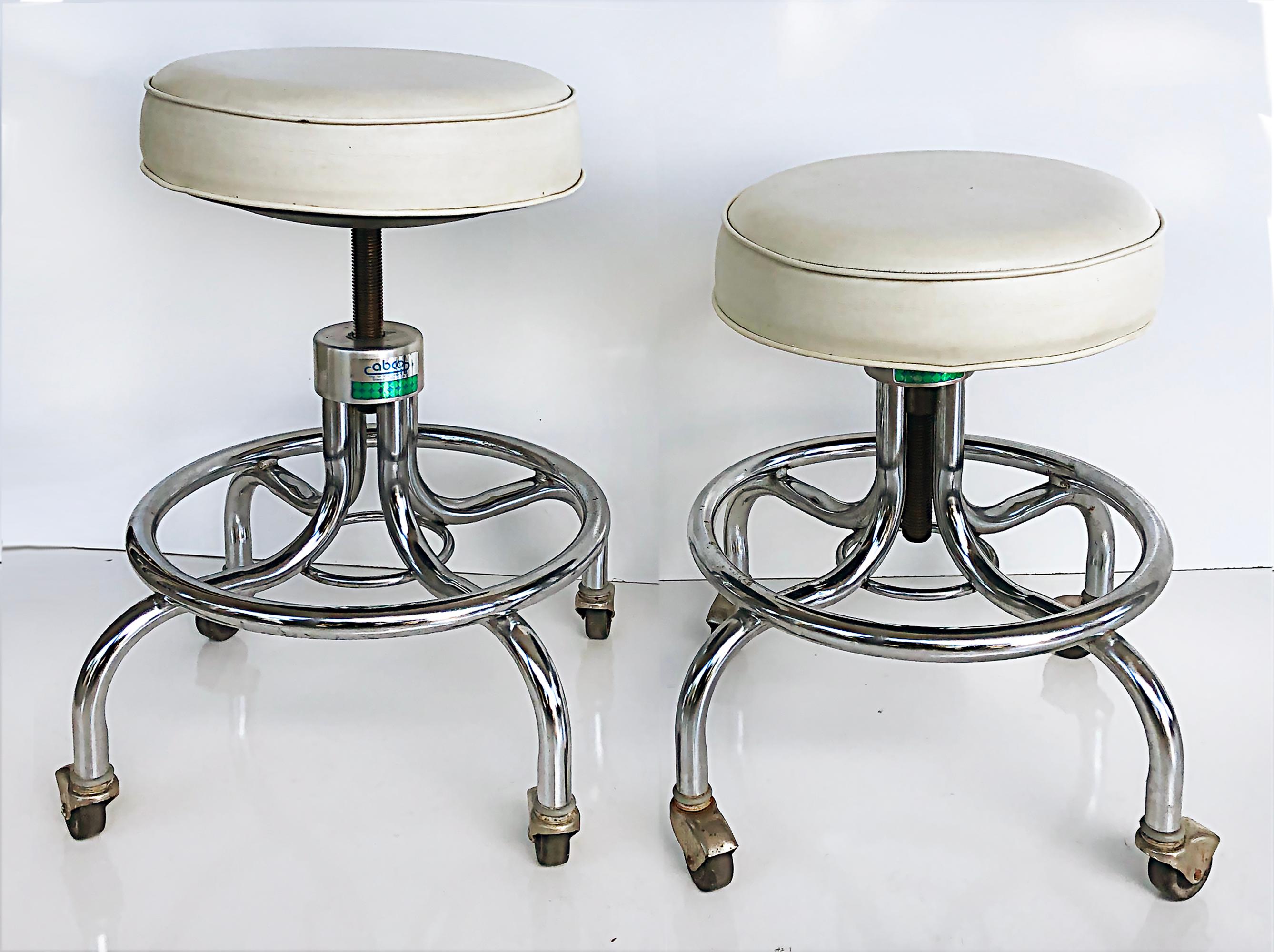 Midcentury Industrial adjustable Chrome counter stools on casters, pair

Offered for sale is a pair of midcentury Industrial chrome counter height stools that have adjustable seats. The legs of the stools are on casters and the seats have their