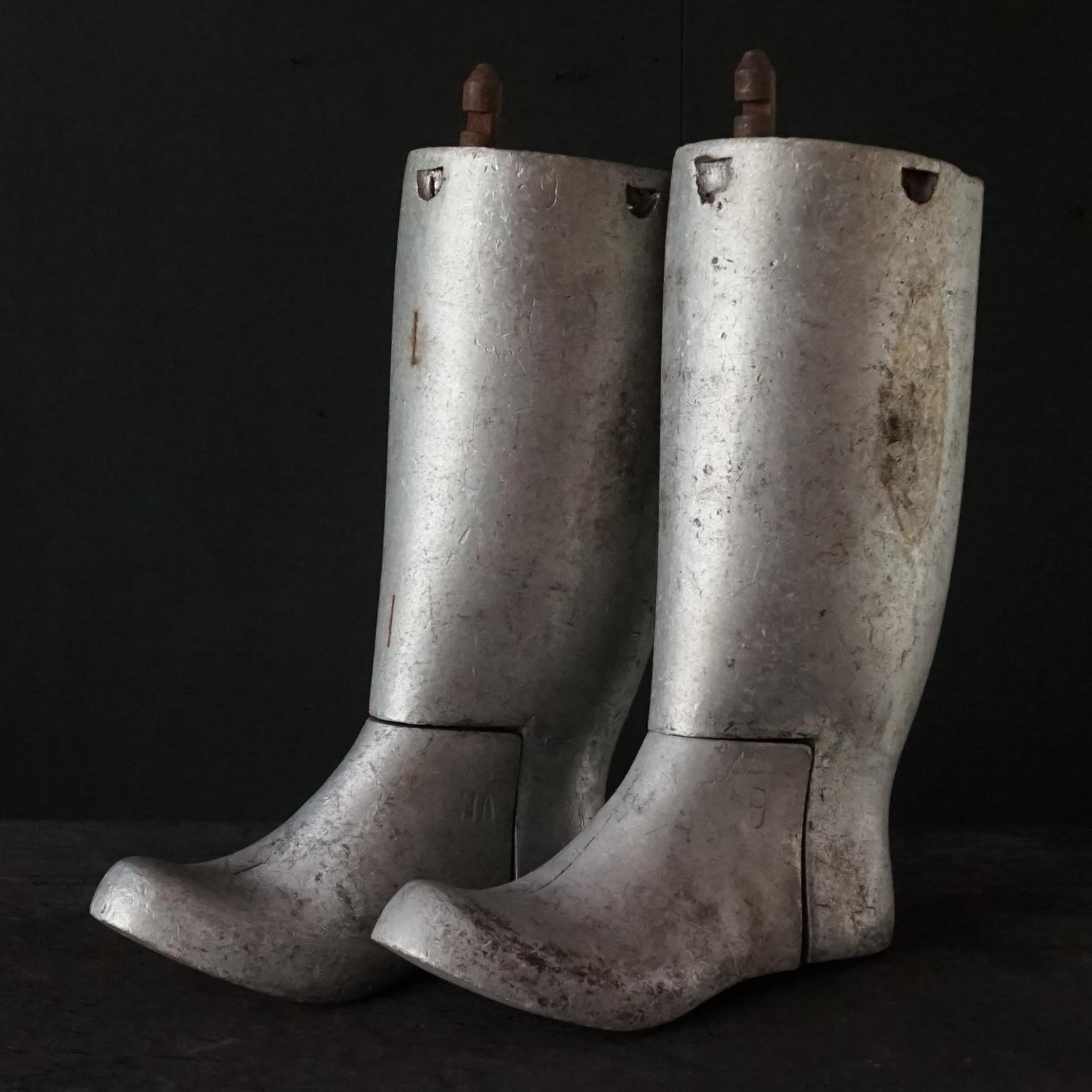 Nice decorative 1950s industrial cast aluminium industrial set of two left rubber boot moulds in size 9 men. They are not solid all the way but still very thick and heavy. 
Both stamped with factory numbers and mould info (NA, N, G and 9). 
The