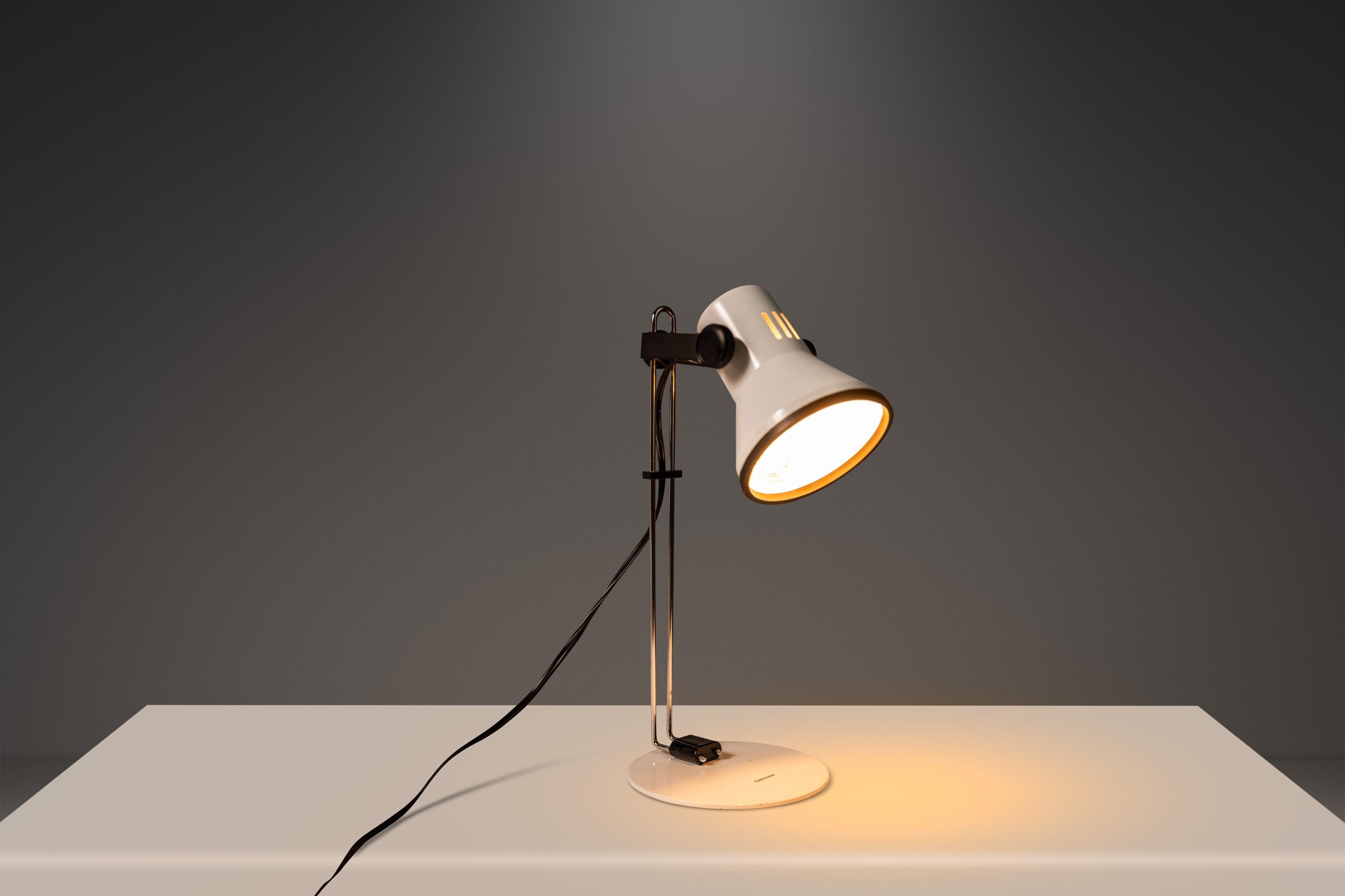 About: Introducing a Tensor adjustable desk or table lamp with perfect 1970's Industrial styling that is small in size but great for tight space for its small footprint. Enameled base and shade, chrome stem, with adjustable height and angle. Works