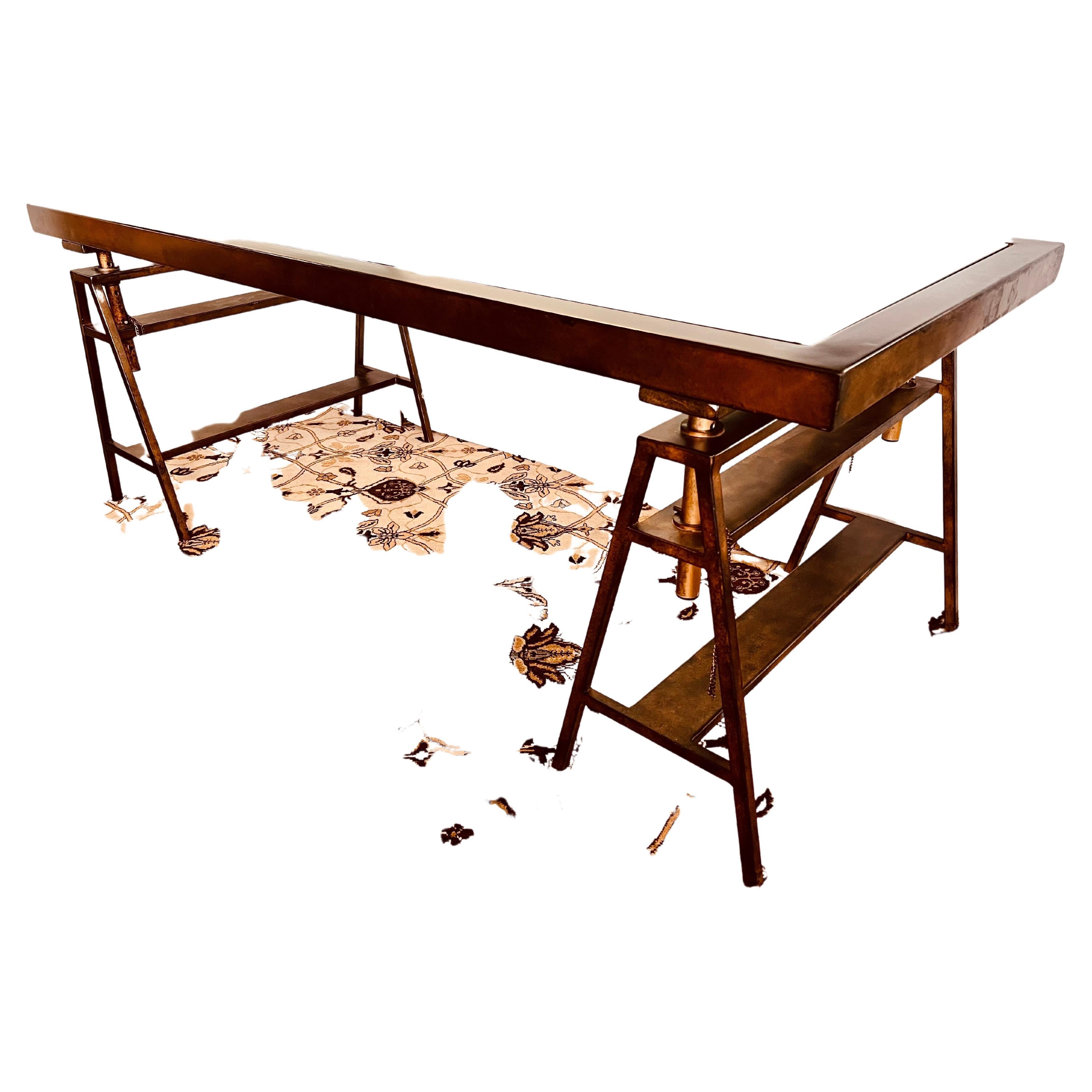 Fabulous saw horse style industrial age desk painted in bronze finish. Content is metal and glass and this is a great, iconic mid century style desk. Note the height is adjustable which is ingenious. Own the best.