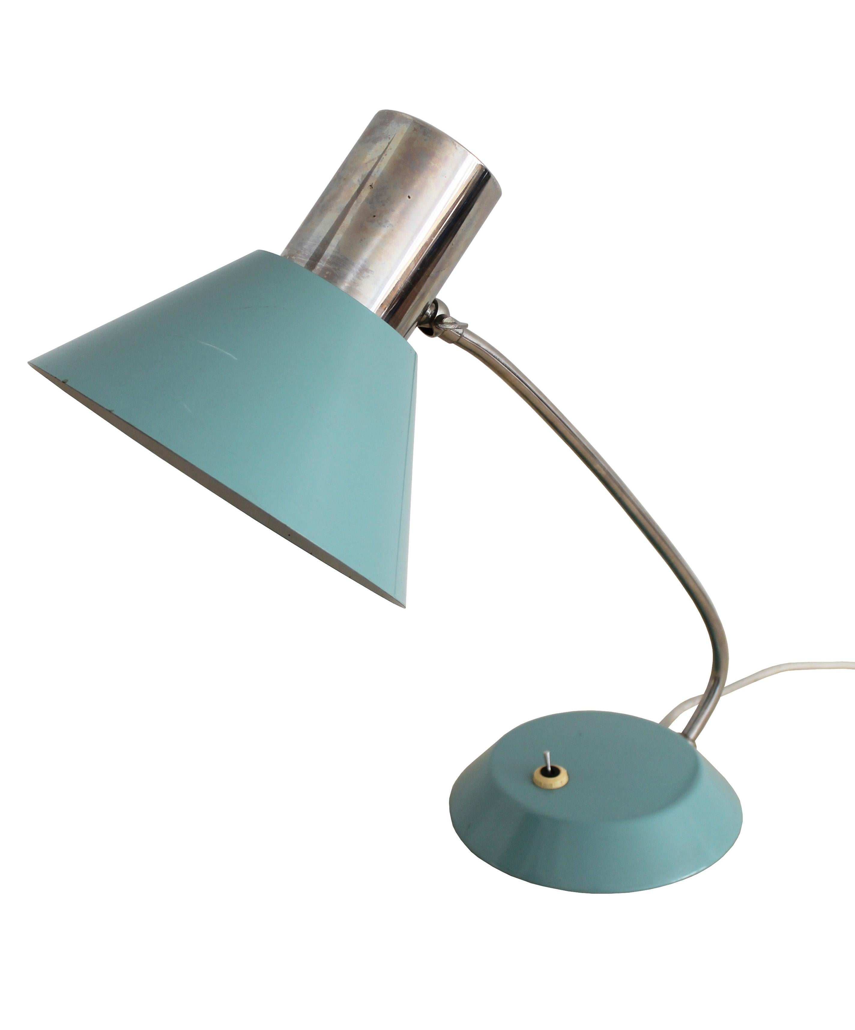 A steel Industrial table lamp sourced from a factory in former Czechoslovakia. Despite being used in a textile factory, this lamp has an elegant shape and a beautiful turquoise blue color which would be a perfect addition to any modern interior.