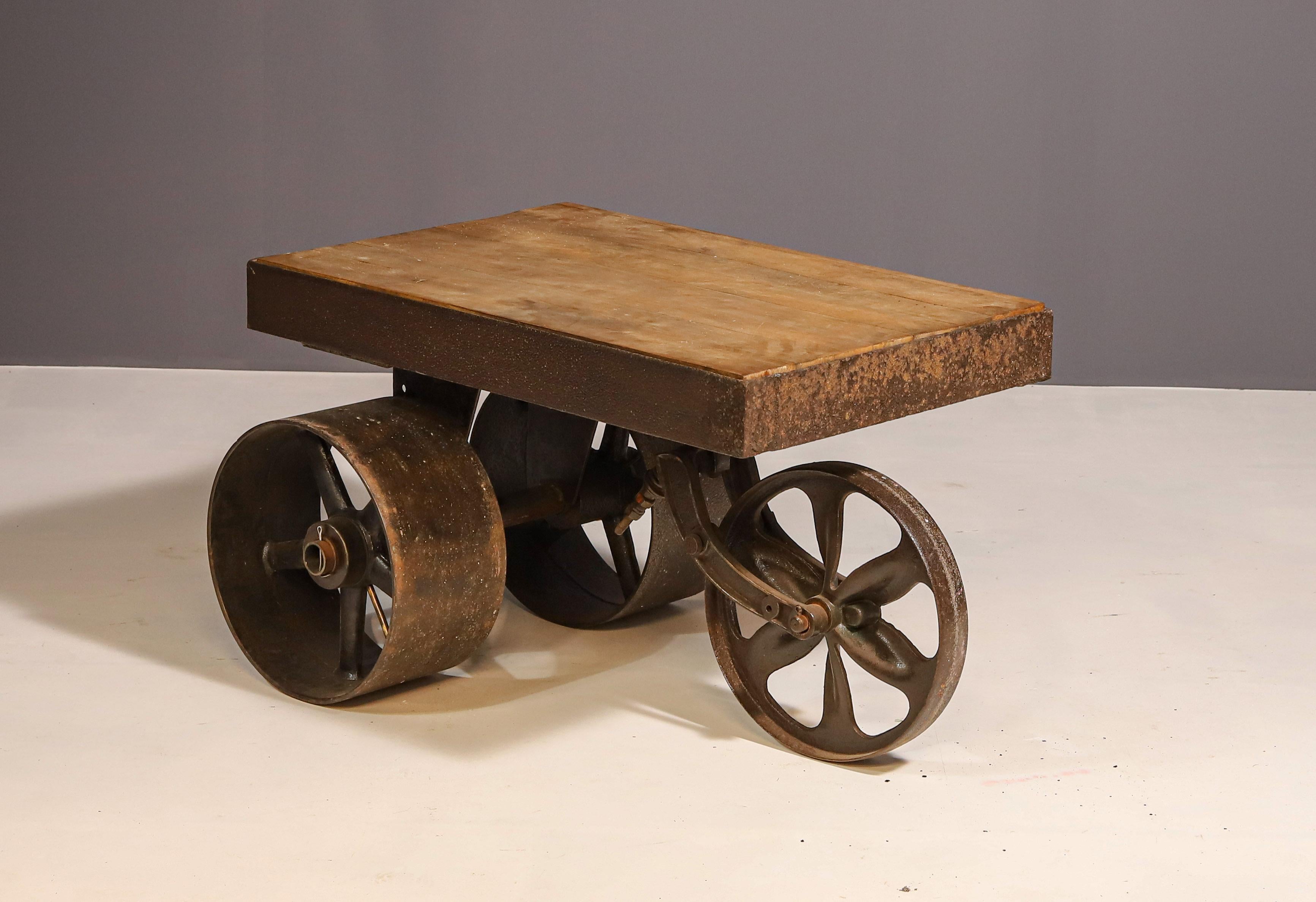 industrial table on wheels, made in the 60s in the former Czechoslovakia. Suitable as, for example, a serving table, a coffee table for the living room, etc. It is in excellent condition, the wood has been sanded and varnished, the iron wheels have