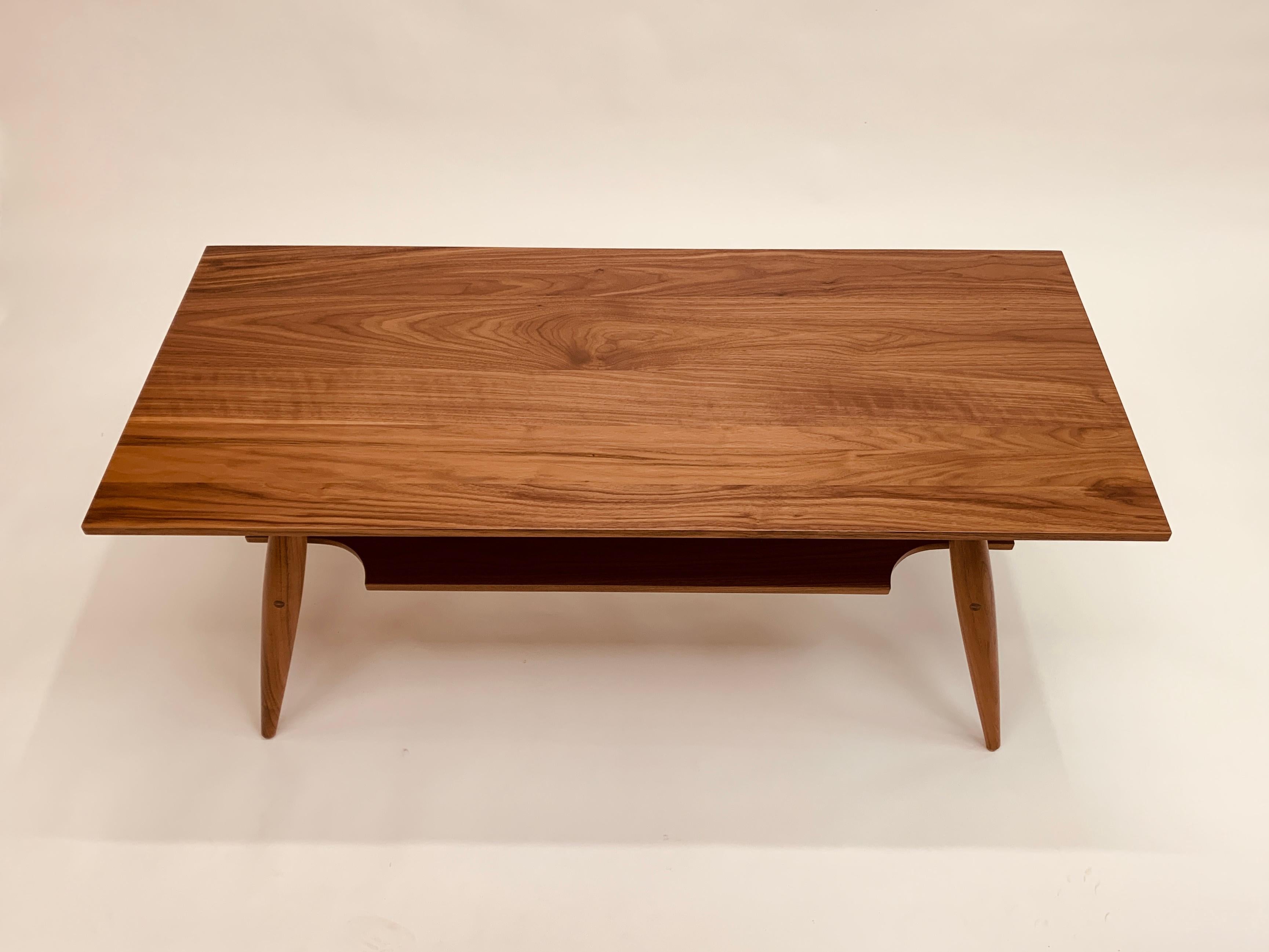 The Carry Underwood coffee table is a sleek, mid-century-inspired, coffee table with storage underneath.  Real traditional joinery, with wedges on the rail tenons to ensure a lifetime without wobbles.  

The piece comes with white glove delivery to