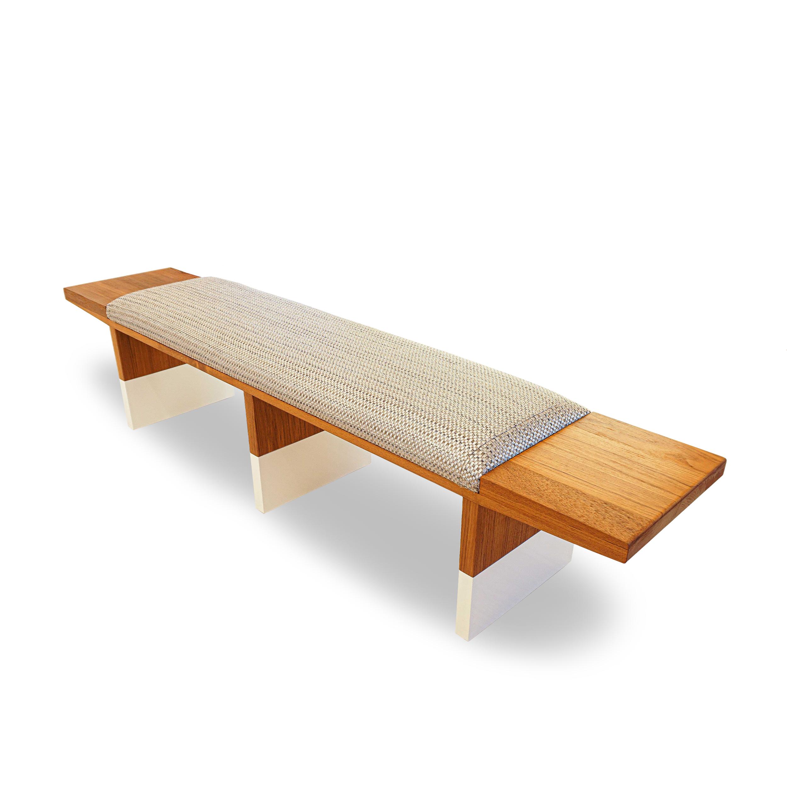 Mid-century inspired teak bench with protective clear coat finish and White Lacquer Dipped Legs. Topped with a 1 1/2