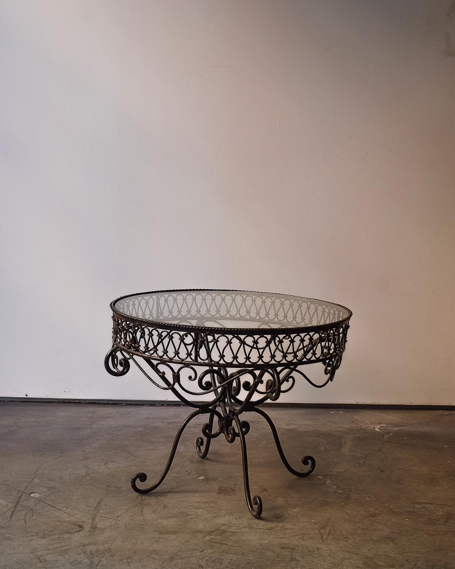 A gorgeous Glass and Iron Coffee table. Handcrafted and custom made.